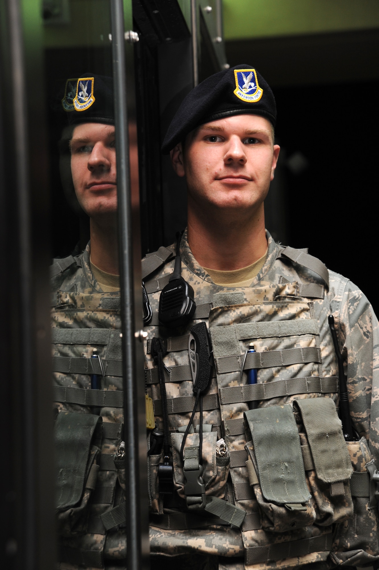 Senior Airman Keegan Jarvis, 22nd Security Forces Squadron installation entry control guard, observes oncoming traffic at McConnell’s main gate, June 2, 2010, McConnell Air Force Base, Kan.  Entry control guards are the first line of defense for the installation and the first contact visitors have with Team McConnell.  The 22nd SFS provides security 24-hours a day, seven days a week for more than 14,000 personnel and assets up including the more than 8,000 vehicles that pass though entry control points daily.  The 22nd SFS members work eight-hour shifts, not including two additional hours before and after shift change to issue, clean and return weapons and equipment.  The 22nd SFS has approximately 160 active-duty members, more than 20 guardsmen and reservists on active duty orders and more than 15 civilians who provide security and patrol for McConnell.  (U.S. Air Force photo/Tech. Sgt. Chyrece Campbell)