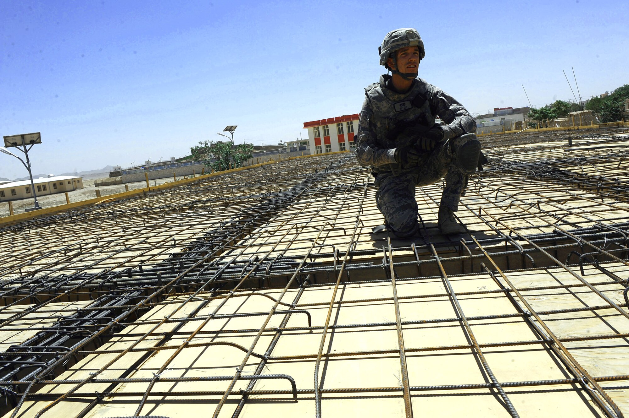 First Lieutenant Keith Yelk checks construction progress of an outpatient clinic at the S.Malakhi Provincial Hospital May 27, 2010, in Qalat City, Afghanistan. Lieutenant Yelk is a civil engineer assigned to Provincial Reconstruction Team Zabul. (U.S. Air Force photo/Staff Sgt. Manuel J. Martinez) 
