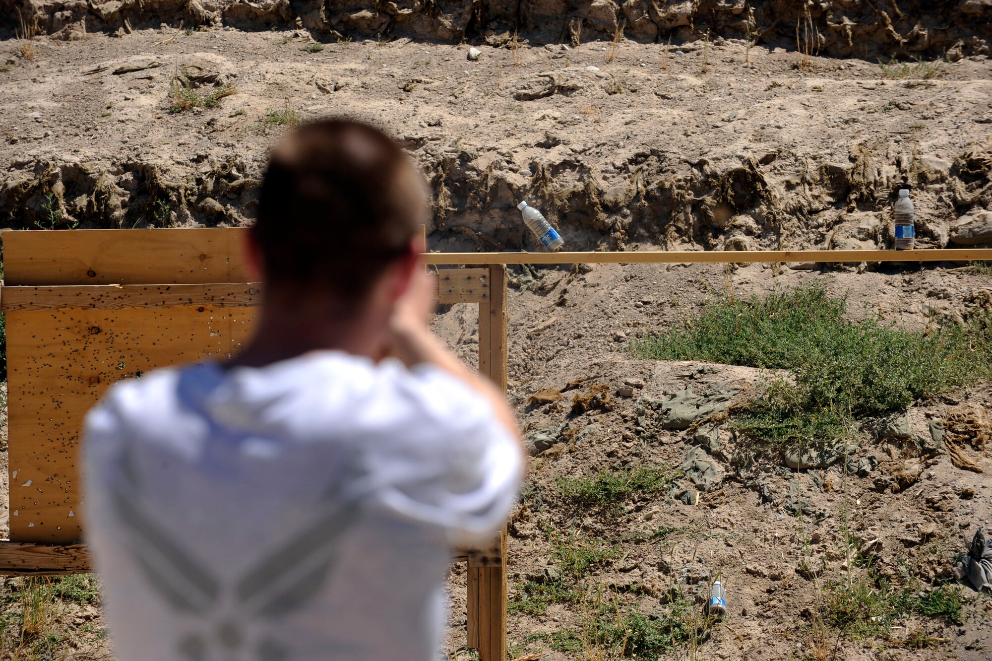 An Airman assigned to Provincial Reconstruction Team Zabul fires an M-9 pistol at the sharpshooter event during the team's morale day, ''Amazing Race,'' competition May 29, 2010, Forward Operating Base Smart, Afghanistan.  (U.S. Air Force photo/Staff Sgt. Manuel J. Martinez/released) 
