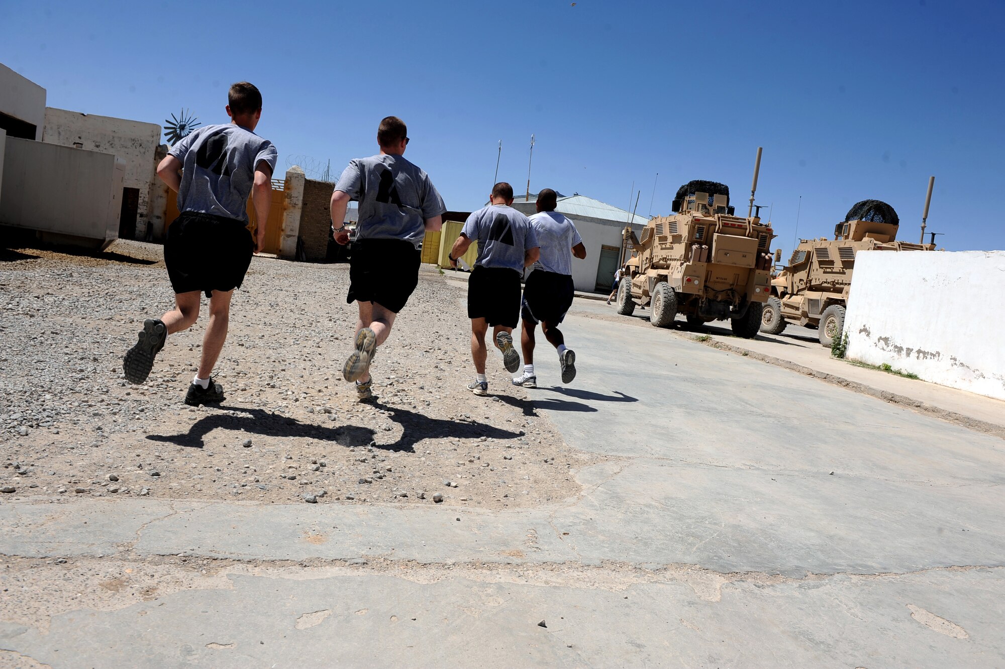 Airman and Soldiers assigned to Provincial Reconstruction Team Zabul rush to the first station of their morale day, ''Amazing Race,'' competition May 29, 2010, Forward Operating Base Smart, Afghanistan. (U.S. Air Force photo/Staff Sgt. Manuel J. Martinez/released) 
