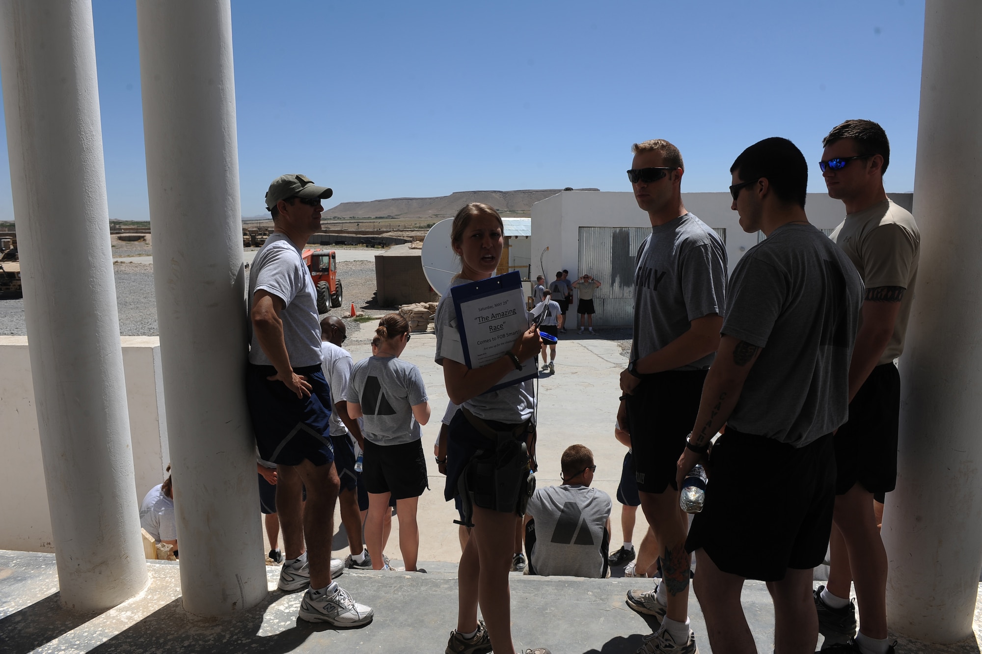 Senior Airman Cassie Webster, a medical technician assigned to Provincial Reconstruction Team Zabul, gets contestants in place for their morale day, ''Amazing Race,'' competition May 29, 2010, at Forward Operating Base Smart, Afghanistan. ?Today was about breaking away from missions and just enjoying a day of PT and good competition,? Senior Airman Webster said, morale day coordinator of "The Amazing Race," deployed from Hurlburt Field, Fla. (U.S. Air Force photo/Staff Sgt. Manuel J. Martinez/released)  