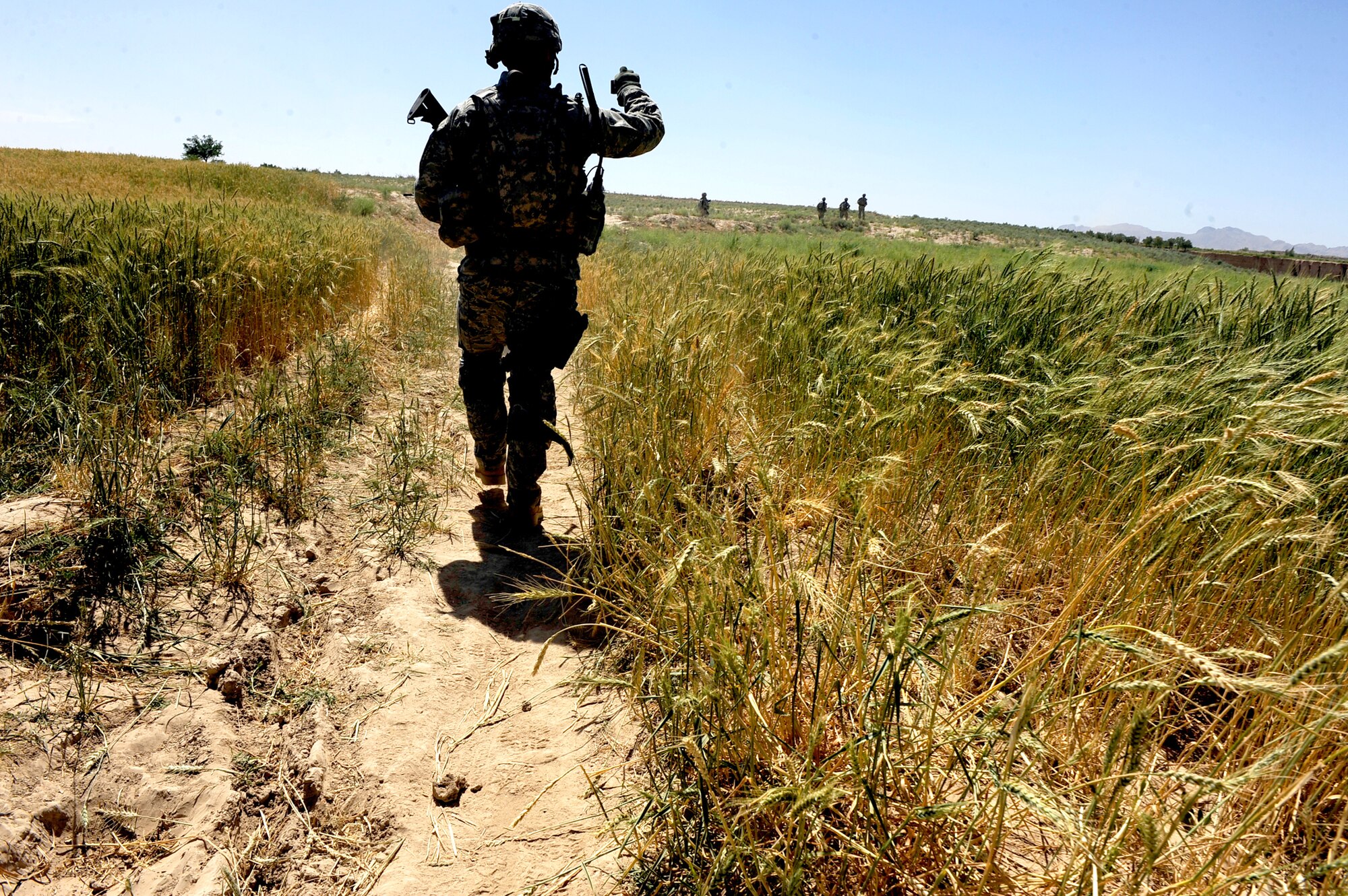 Airmen and Soldiers assigned to Provincial Reconstruction Team Zabul leave Khaleqdad Khan village and head back to their vehicles May 24, 2010, near Khaleqdad Khan, Afghanistan. (U.S. Air Force photo/Staff Sgt. Manuel J. Martinez)