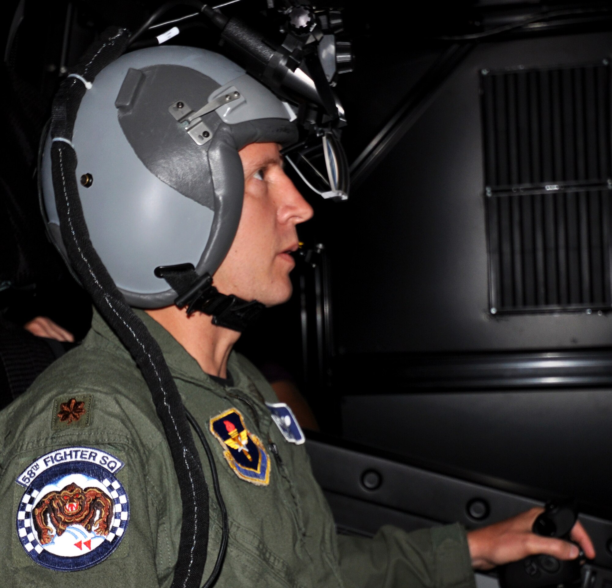 Maj. Eric Smith flies the 33rd Fighter Wing mission rehearsal trainer for the F-35 Lightning II during a demonstration May 27, 2010, at Eglin Air Force Base, Fla. The trainer will use state of the art technology to further familiarize students with the F-35. Major Smith is the 58th Fighter Squadron assistant operations director. (U.S. Air Force photo/ Ashley M. Wright)