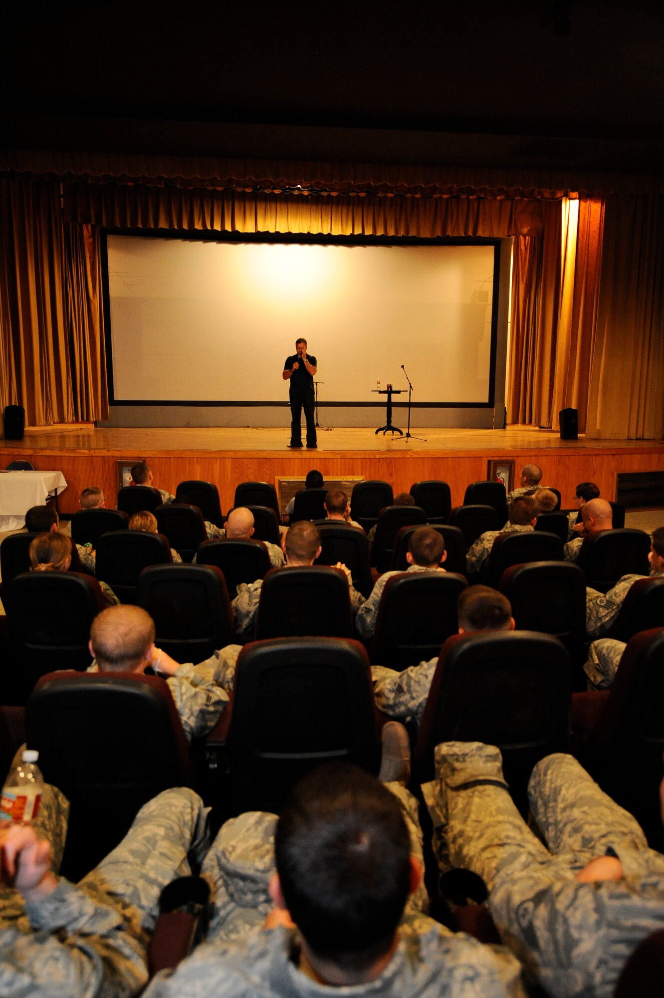 HOLLOMAN AIR FORCE BASE, N.M. -- Bernie McGrenahan, a well-renowned stand-up comedian, speaks to Team Holloman members about the dangers of alcohol, drugs, sexual conduct and suicide with his "HAPPY HOUR" comedy show during the 49th Fighter Wing Safety Day June 1, 2010. The Safety Day coincided with "day one" of the 101 Critical Days of Summer campaign -- an Air Force initiative to increase safety awareness during the mishap-prone summer months. (U.S. Air Force photo by Airman 1st Class Veronica Stamps / Released)
