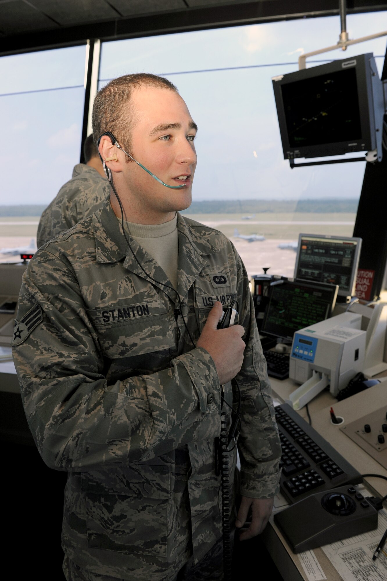 Senior Airman Kevin Stanton, a 19th Operational Support Squadron air traffic control craftsman, talks to a C-130 crew June 2 on final approach to the runway for a safe landing. The air traffic control tower staff earned the Air Force-level D. Ray Hardin Air Traffic Control Facility of the Year for 2009. The award is given to an air traffic control facility at a particular unit that has made a notable contribution to the air traffic control system. (U.S. Air Force photo by Senior Airman Ethan Morgan)