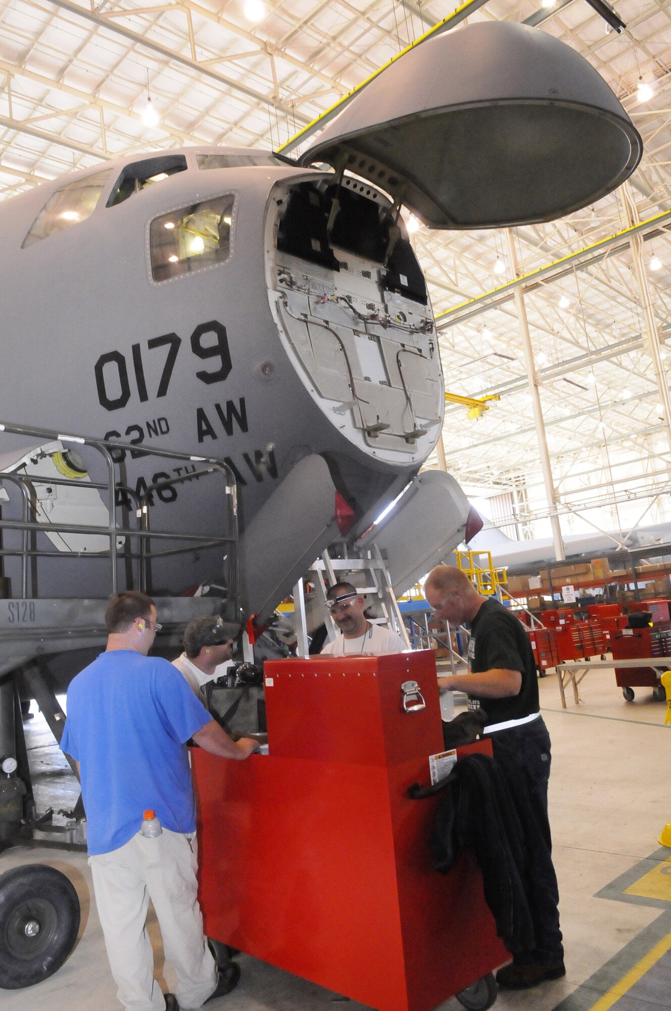 Aircraft mechanics assemble their tools in preparation of their work on a C-17 recently. The 402nd Maintenance Wing was given the 2010 Maintenance Repair & Overhaul Military Center of Excellence Award earlier this year by Aviation Week. U. S. Air Force photo by Sue Sapp