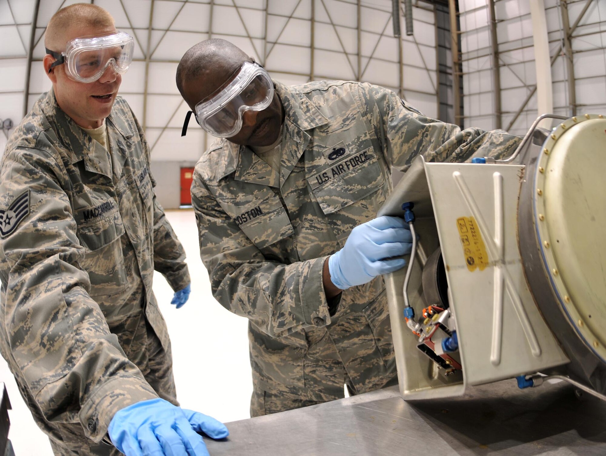 Staff Sgt. Joseph MacCarrol (left), 512th Maintenance Group fuels systems craftsman sheet metal specialist, and Master Sgt. Dale Coston, 512th MXG fuels systems shift supervisor, conduct an operational check on a valve here May 2. The two maintainers and 134 other reservists from the 512th MXG have been activated to support the troop build-up since April 5. This movement supports President Barack Obama's plan, announced in December, to push 30,000 additional U.S. troops for Operation Enduring Freedom. (U.S. Air Force photo/Senior Airman Andria J. Allmond)