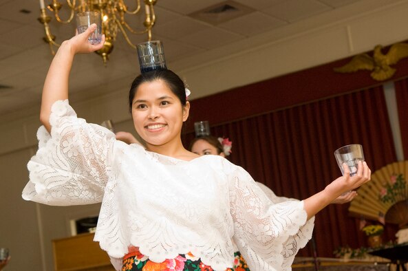 HANSCOM AIR FORCE BASE, Mass. - Binasuan dancer Karen Buenaventura performs with glasses during the Asian Pacific Heritage Month Luncheon at the Minuteman Club on May 26. The luncheon was the final celebration of Asian Pacific American Heritage Month on base and included traditional dance demonstrations, musical performances and more. (U.S. Air Force photo by Mark Wyatt)