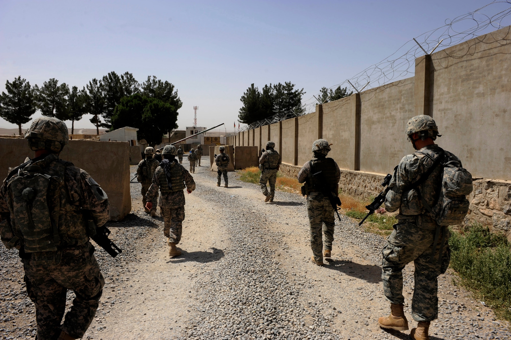 Soldiers and Airmen assigned to the Zabul Provincial Reconstruction Team, head out of an entry control point for a foot patrol May 23, 2010, at Forward Operating Base Smart, Afghanistan. (U.S. Air Force photo/Staff Sgt. Manuel J. Martinez) 
