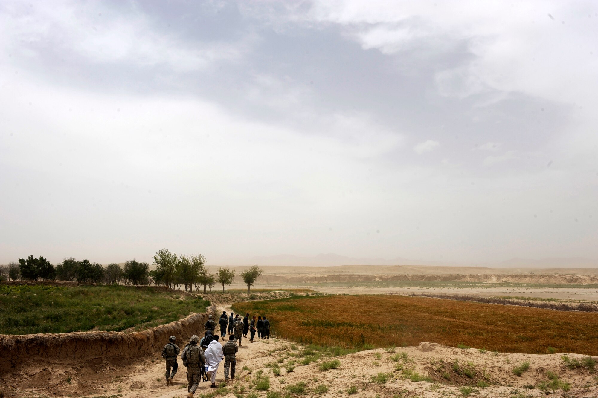 Airmen and Soldiers assigned to Provincial Reconstruction Team Zabul and Afghan National Police head back to their vehicles after a Shura meeting in Omarkhel village May 22, 2010, in Zabul Province, Afghanistan. (U.S. Air Force photo/Staff Sgt. Manuel J. Martinez/released) 