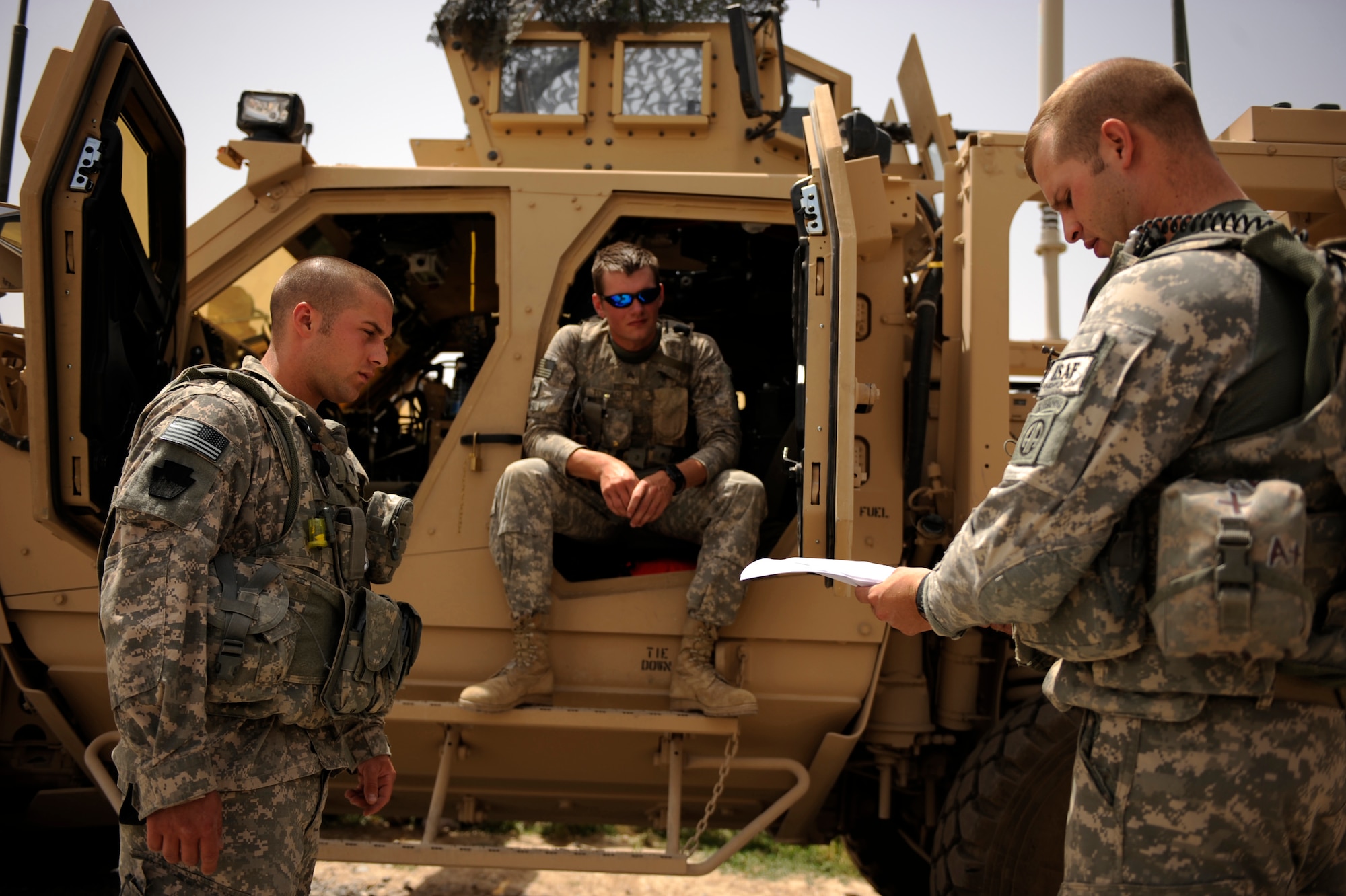 Army Sergeant Robert Crosier, right, a truck commander assigned to Provincial Reconstruction Team Zabul, briefs his gunner and driver before heading out on a Shura mission in a local village May 22, 2010. (U.S. Air Force photo/Staff Sgt. Manuel J. Martinez/released) 