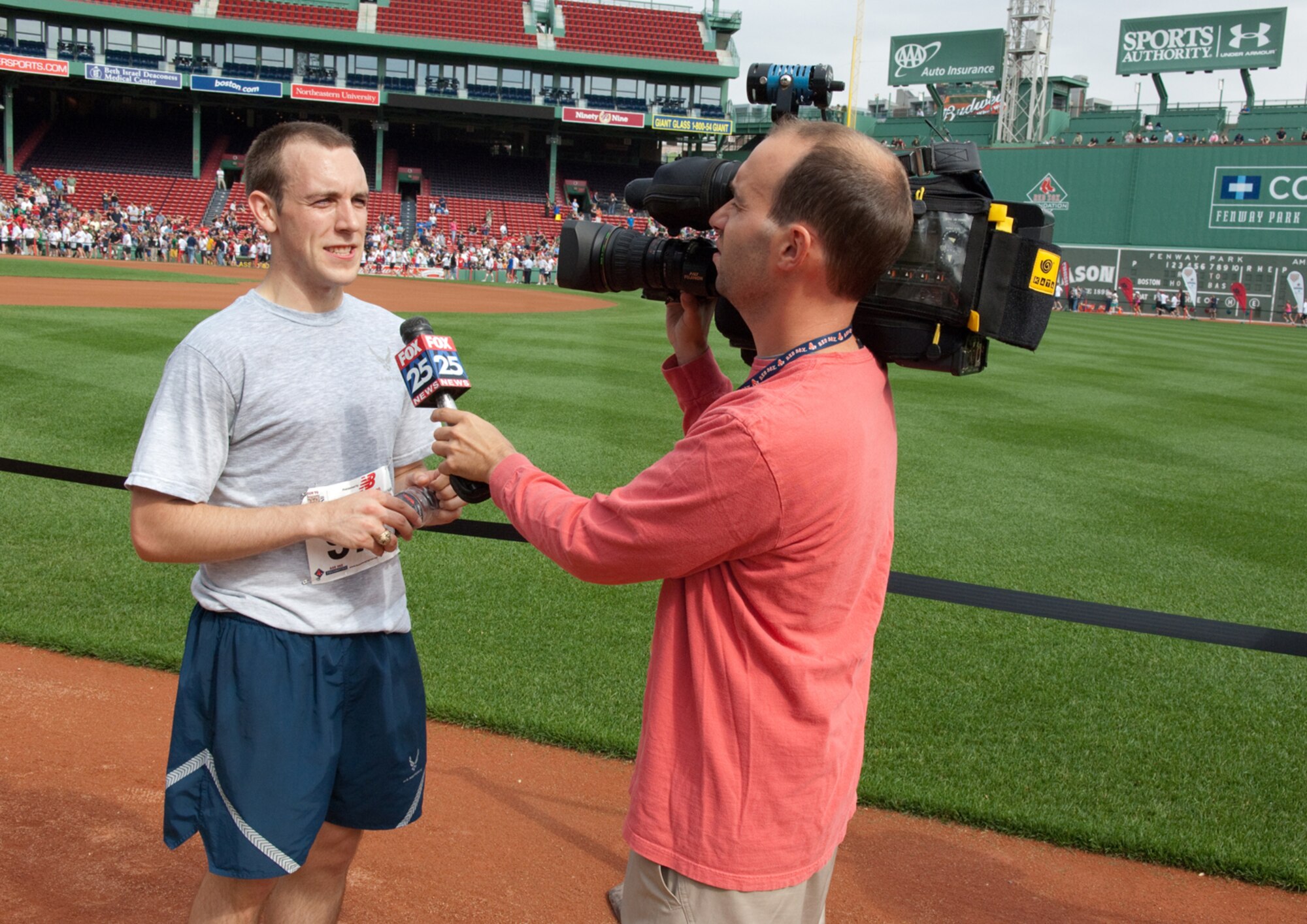 BOSTON – 1st Lt. Ronald Jenkins, 350th Electronic Systems Group, is interviewed after finishing 14th of more than 2,000 participants in the Run to Home Base 9K race at Fenway Park. The race benefitted the Home Base Program, which offers treatment and support to veterans of Operations Iraqi and Enduring Freedom who suffer from traumatic brain injuries and deployment-related stress disorders.  (U.S. Air Force photo by Rick Berry)