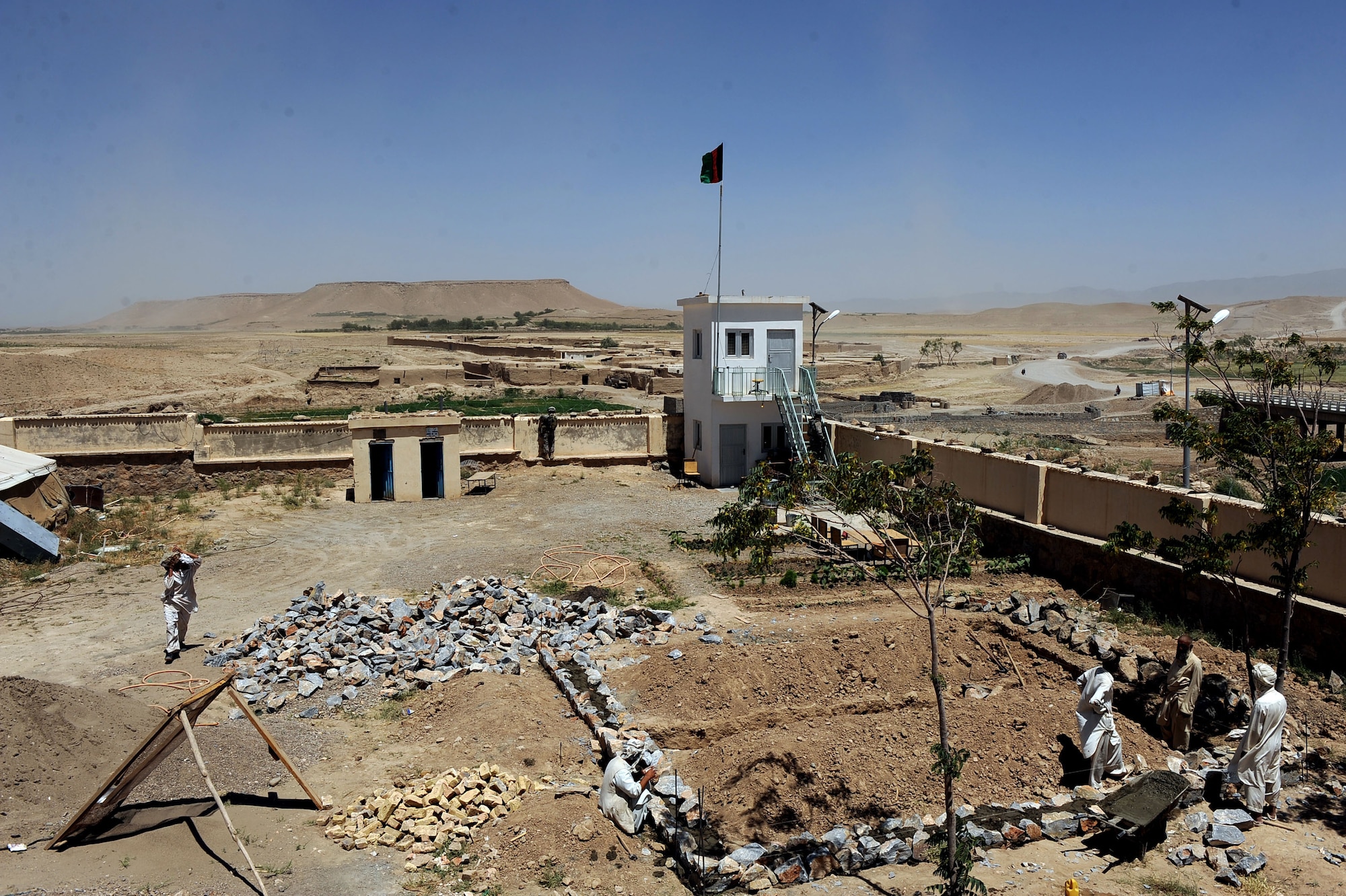 Afghan workers set the foundation of an indoor bathroom for the S.Malakhl Provincial Hospital, during a site visit by Provincial Reconstruction Team Zabul May 27, 2010, in Qalat City, Afghanistan. Currently Zabul Team has 14 PRT-led projects including Tarnak bridge reconstruction, hospital improvements, perimeter wall repairs, school construction and improvements, emergency road repairs, trash services, nursery security upgrades, and irrigation wells. These projects, coupled with several other improvement operations being led by Afghan government officials, are organized and prioritized to best benefit the people here.(U.S. Air Force photo/Staff Sgt. Manuel J. Martinez/released) 