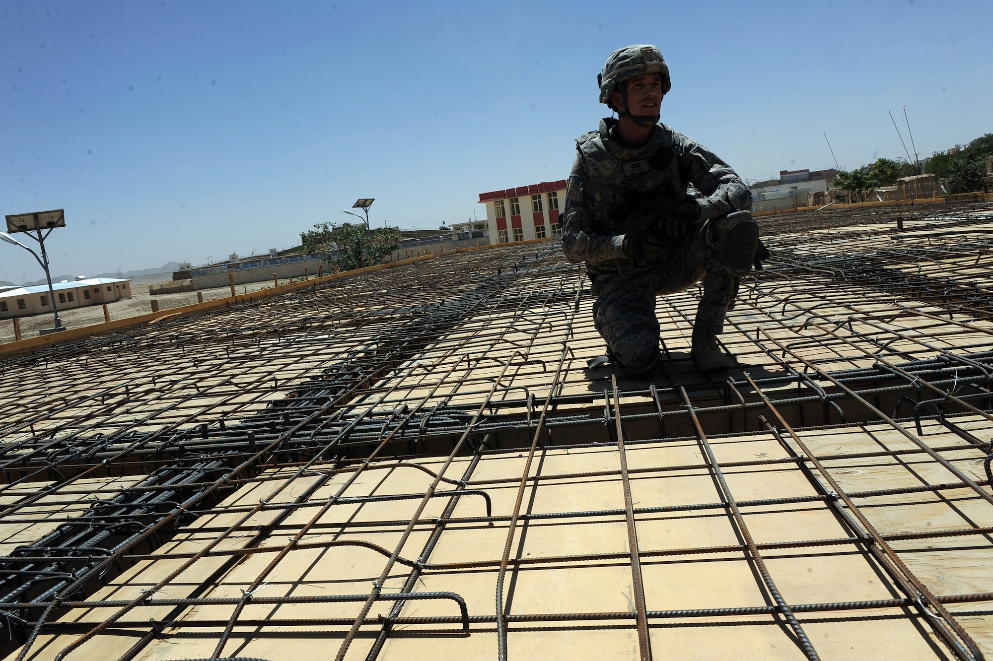 First Lieutenant Keith Yelk, a civil engineer assigned to Provincial Reconstruction Team Zabul, checks construction progress of an outpatient clinic at the S.Malakhi Provincial Hospital May 27, 2010, in Qalat City, Afghanistan. ''We have helped facilitate project-coordination meetings developed by Afghan leadership in the region to improve communication and prioritize the best projects for Afghan citizens,? said Lieutenant Yelk, deployed from Nellis Air Force Base, Nev. ?It allows us to better fulfill reconstruction needs in the region and builds credibility with the Afghan citizens and their government to meet their region's expectations.? (U.S. Air Force photo/Staff Sgt. Manuel J. Martinez/released) 
