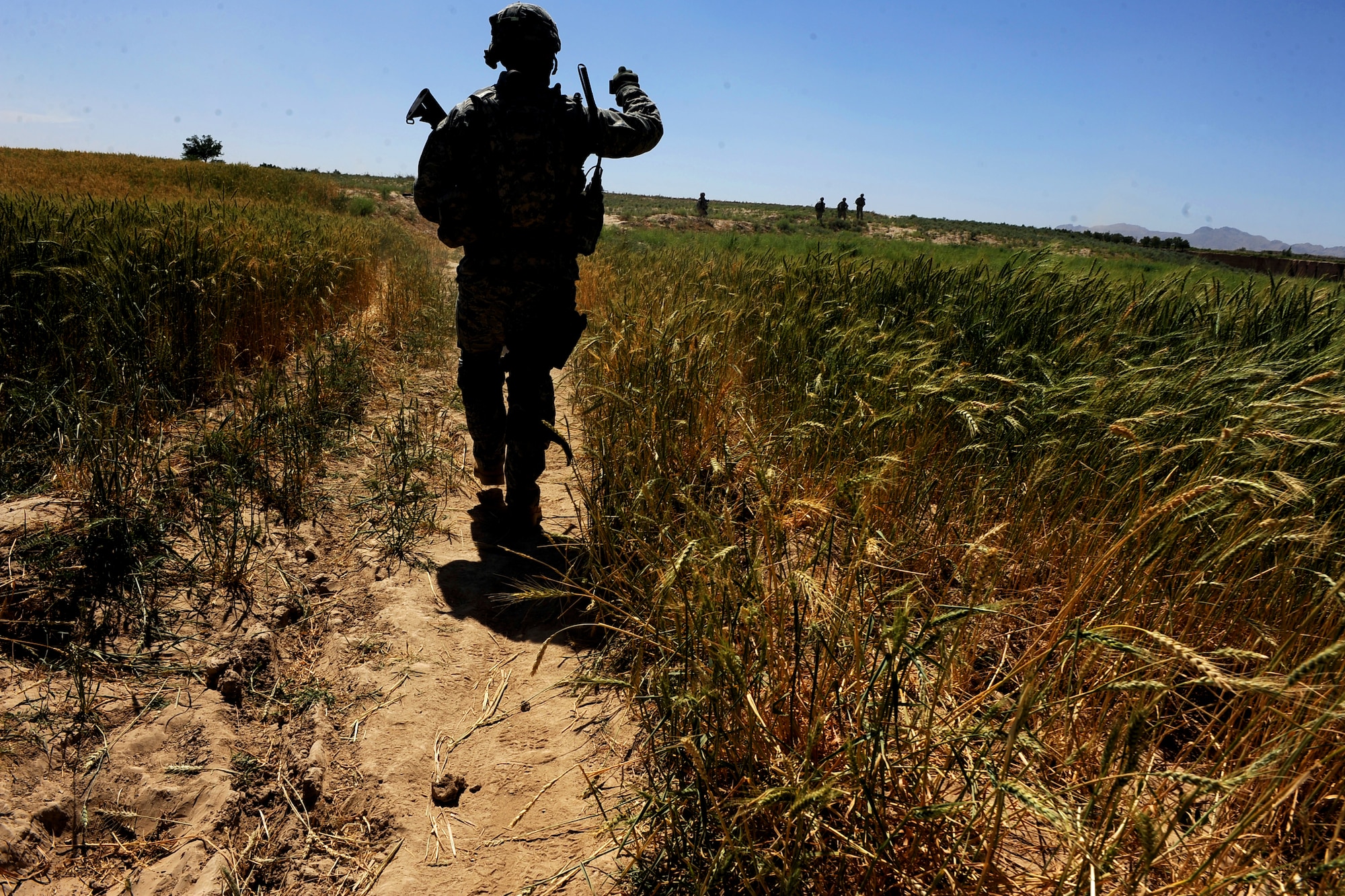 Airmen and Soldiers assigned to Provincial Reconstruction Team Zabul leave Khaleqdad Khan village and head back to their vehicles May 24, 2010, near Khaleqdad Khan, Afghanistan. (U.S. Air Force photo/Staff Sgt. Manuel J. Martinez/released) 