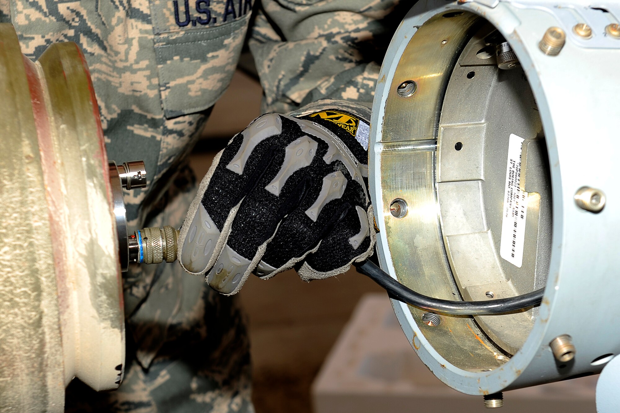 An U.S. Air Force Airman from the 455th Expeditionary Maintenance Squadron/AMMO attaches the tail section to for a 500 lb guided bomb unit at Bagram Airfield, Afghanistan. (U.S. Air Force photo by/ Master Sgt. Jeromy K. Cross/released)