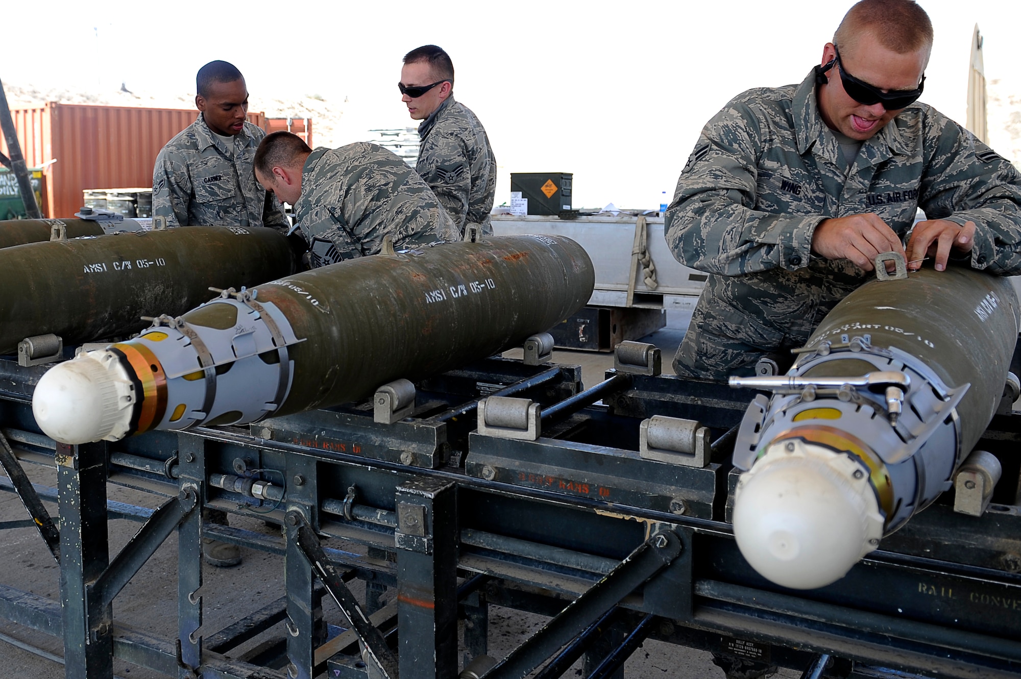 U.S. Air Force Airmen from the 455th Expeditionary Maintenance Squadron/AMMO build 500 lb guided bomb units at Bagram Airfield, Afghanistan. (U.S. Air Force photo by/ Master Sgt. Jeromy K. Cross/released)