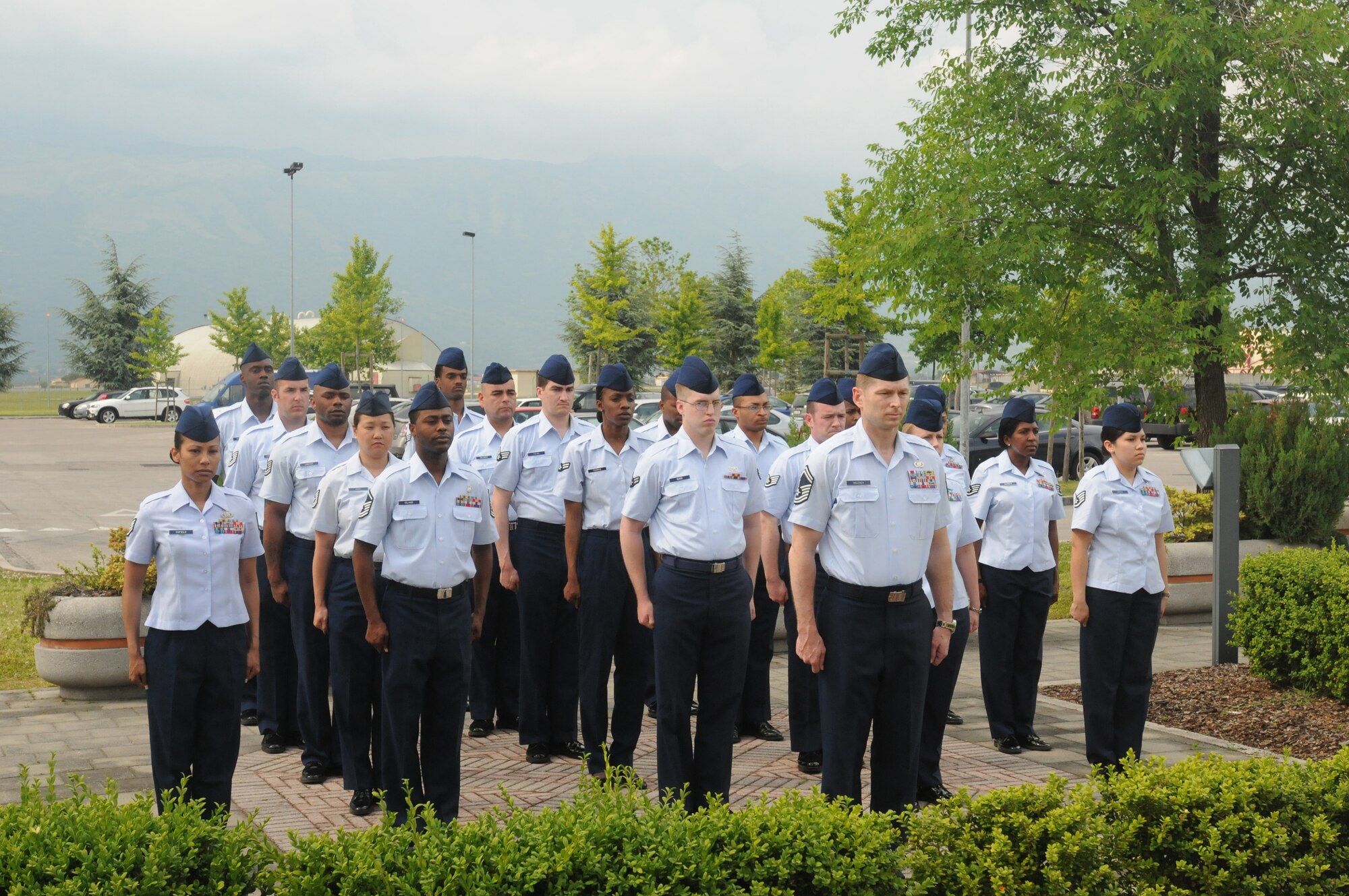 Aviano Airmen stand at attention during a Memorial Day retreat ceremony May 28 in front of the 31st Fighter Wing Headquarters building. (U.S. Air Force photo/ Airman LaVel Sterling)