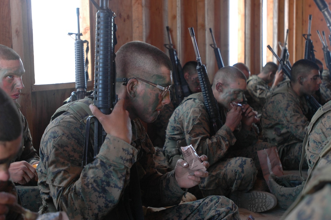 Pfc. Patrick Collman eats chow during a core values discussion during the Crucible at Camp Pendleton, Calif., June 3.