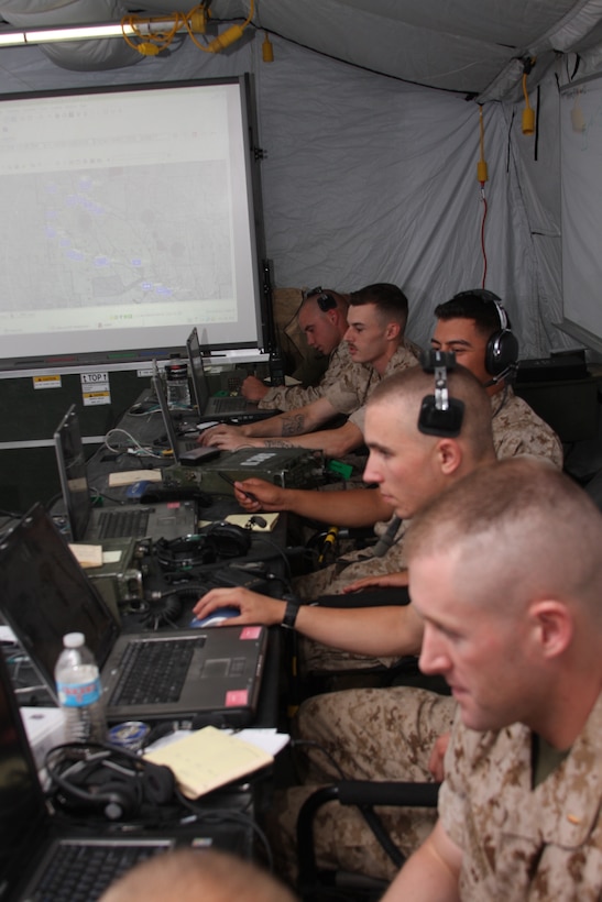 Marines from 3rd Light Armored Reconnaissance Battalion monitor computers and radios in the combat operations center at the battalion’s light armored vehicle ramp June 4 as part of Command Post Exercise Menacing Name, a COC familiarization training sequence. Roughly 50 Marines from 3rd LAR participated in the exercise, along with several COC instructors from the Battle Simulation Center and Marine Air-Ground Task Force Integrated Systems Training Center, known as MISTC, who acted as observers providing over-the-shoulder assistance and simulations.::r::::n::
