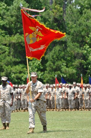 Sgt. Maj. Charles T. Blumenberg, sergeant major of Combat Logistics Regiment 25, marches the unit colors to present them to Col. Craig C. Crenshaw as he relinquished command to Col. Christopher B. Edwards in a ceremony held aboard Camp Lejeune, N.C., June 4, 2010.