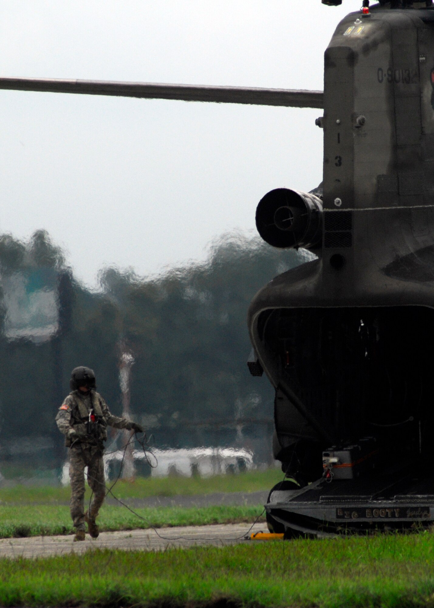 A 1st Battalion, 228th Aviation Regiment aircrew member from Joint Task Force-Bravo prepares to take off June 4 to deliver food and water to communities affected by Tropical Storm Agatha and the Pacaya Volcano. Joint Task Force-Bravo’s helicopters and personnel transported nearly 53,000 pounds of relief supplies June 3-4 to Guatemalan communities in need. (U.S. Air Force photo by Staff Sgt. Bryan Franks)