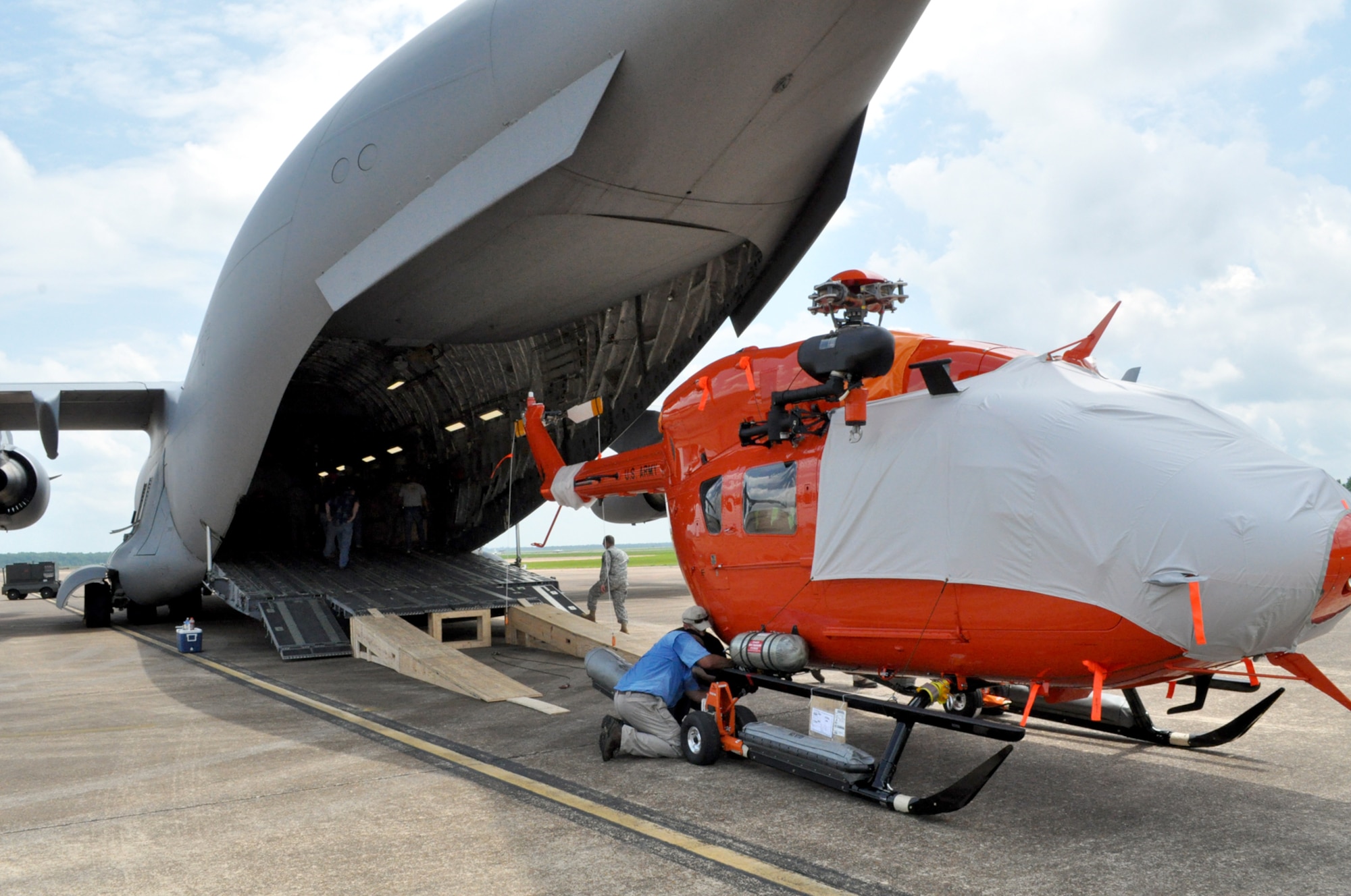 A modified UH-72 Lakota is loaded onto a C-17 Globemaster III June 4 at Columbus Air Force Base. The Lakota's were modified for use in inter-island transport and other unique aspects of the mission at U.S. Army Kawjalein Atoll/Reagan Test Site. (U.S. Air Force photo/Sonic Johnson). 