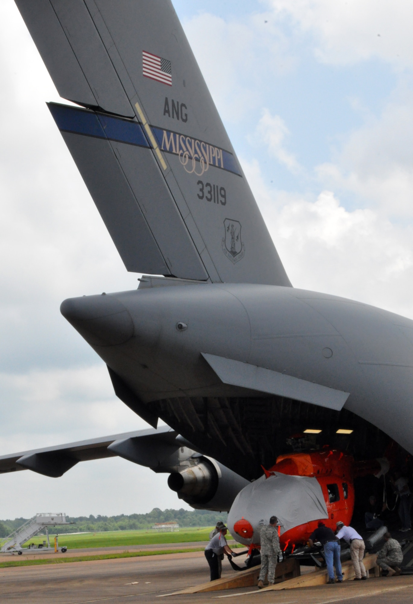 Members of the U.S. Army and American Eurocopter load a modified UH-72 Lakota onto a C-17 Globemaster III June 4 at Columbus Air Force Base. The C-17 is assigned to the Mississippi Air National Guard. (U.S. Air Force photo/Sonic Johnson). 