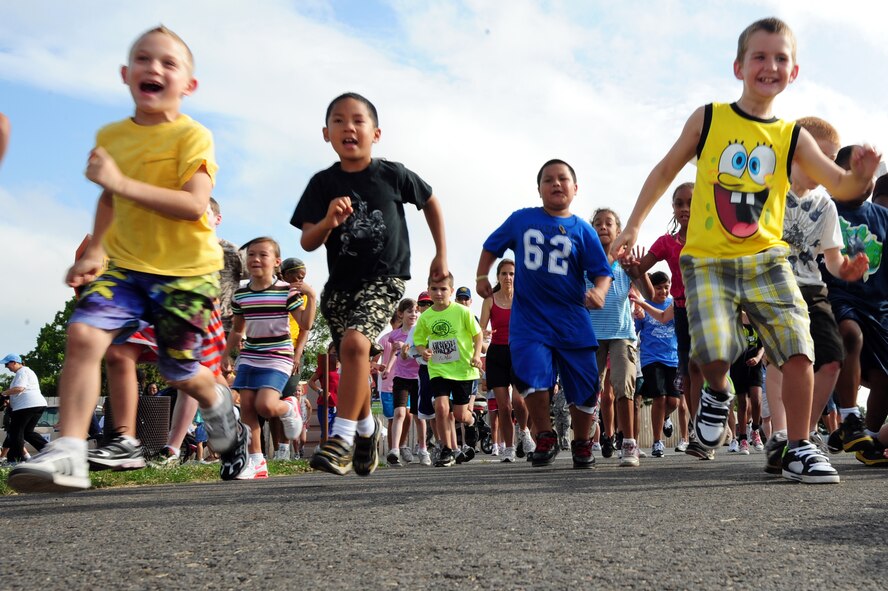 BARKSDALE AIR FORCE BASE, La. – Participants in the America’s Armed Forces Kids Run take-off from the starting line on the two-mile trail outside the fitness center June 4. The kids run was held to help promote Fit Factor, a youth fitness initiative that encourages children to be physically active every day and make healthy eating and lifestyle choices. (U.S. Air Force photo by Senior Airman Joanna M. Kresge)