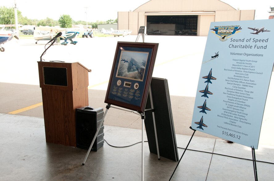 Members of the 139th Airlift Wing and St. Joseph community leaders come together to award donations collected at the Sound of Speed Air Show on June 2, 2010. The Sound of Speed Air Show was hosted at Rosecrans Air National Guard base in May, 2010. (U.S. Air Force photo by Master Sgt. Shannon Bond) (RELEASED)