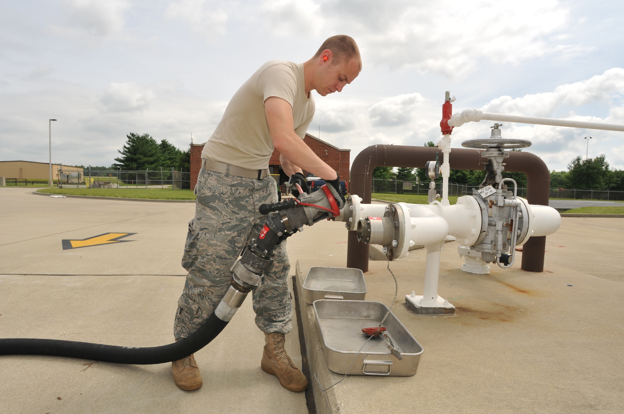 Senior Airman Andrew Kasten, a fuels laboratory technician for the 126th
Fuels Management flight, transfers fuel from holding tanks to a fuel truck
located at the 126th Air Refueling Wing, Scott AFB, Ill. The Illinois Air
National Guard flight was recently named "The Best in the Air National
Guard" and received the Air National Guard Outstanding Fuels Management
Flight Award for the best fuels operations for 2009. (U.S. Air Force photo
by Master Sgt. Ken Stephens)