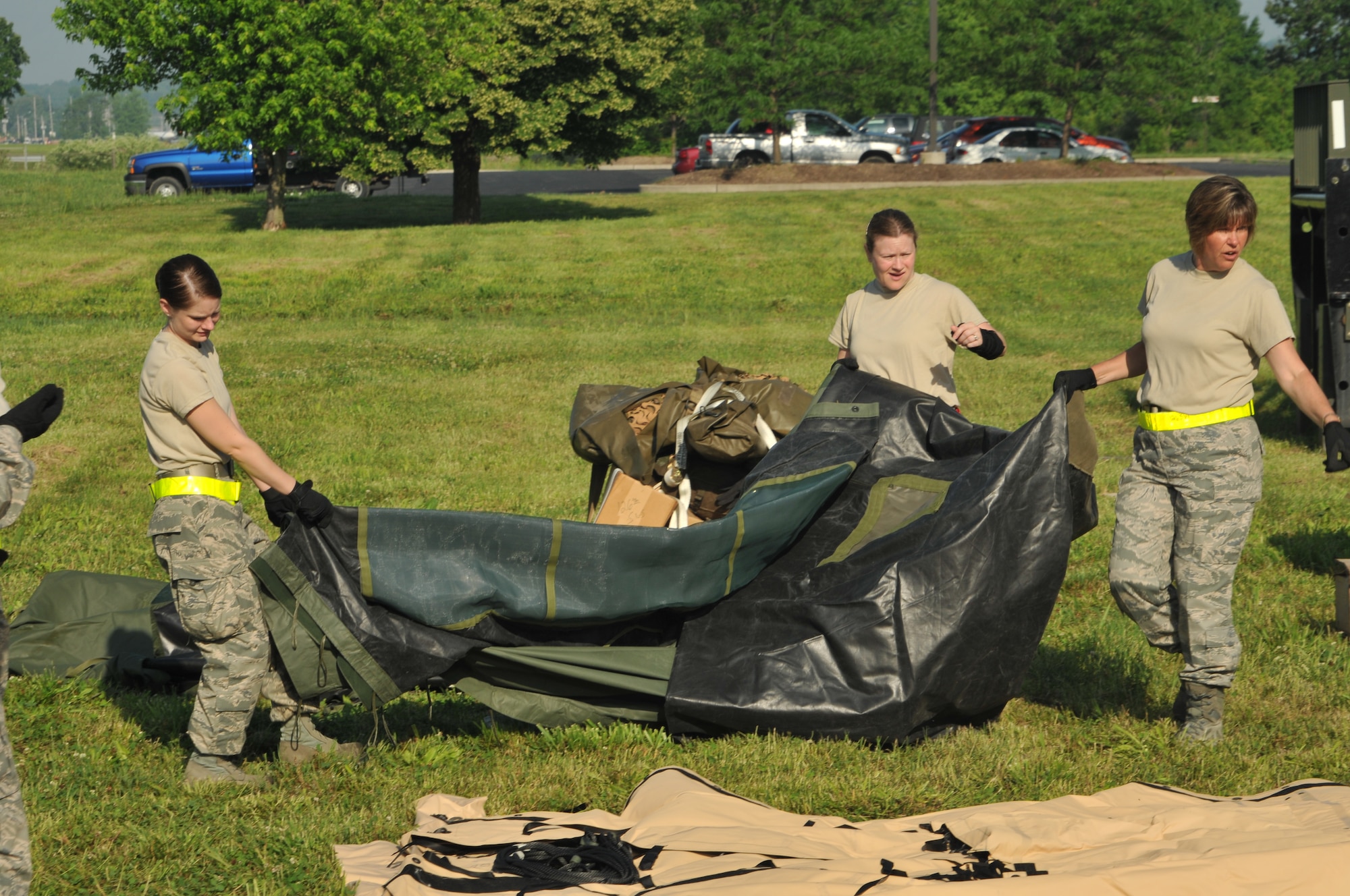 The 126th Force Support Squadron erect tents at the start of a three day bivouac exercise at Scott AFB, Ill. Units of the 126th Air Refueling Wing, Illinois Air National Guard, routinely practice deployment procedures to maintain their state of readiness. (U.S. Air Force photo by Tech Sgt. Johnathon Orrell)