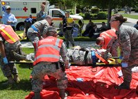 Medical personal provide care to the injured, after a simulated explosion during an emergency response exercise at Travis Air Force Base, California on 12 May 2010. (U.S. Air Force photo by Civ/Jay Trottier)