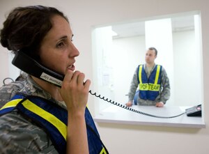 LANGLEY AIR FORCE BASE, Va. – Capt. Marjorie Molloy, personnel deployment function officer in charge, directs Langley Airmen prior to their deployment to Andersen Air Force Base, Guam, June 2. The deployment, which will last approximately four months, is a prudent measure to maintain a credible deterrent posture and presence for the region and demonstrate a continued U.S. commitment to fulfilling security responsibilities throughout the Western Pacific. (U.S. Air Force photo/Staff Sgt. Barry Loo)