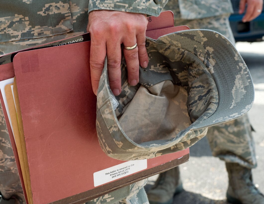 LANGLEY AIR FORCE BASE, Va. – A Langley Airman carries his mobility folder prior to his deployment to Andersen Air Force Base, Guam, June 2. The deployment, which will last approximately four months, is a prudent measure to maintain a credible deterrent posture and presence for the region and demonstrate a continued U.S. commitment to fulfilling security responsibilities throughout the Western Pacific. (U.S. Air Force photo/Staff Sgt. Barry Loo)