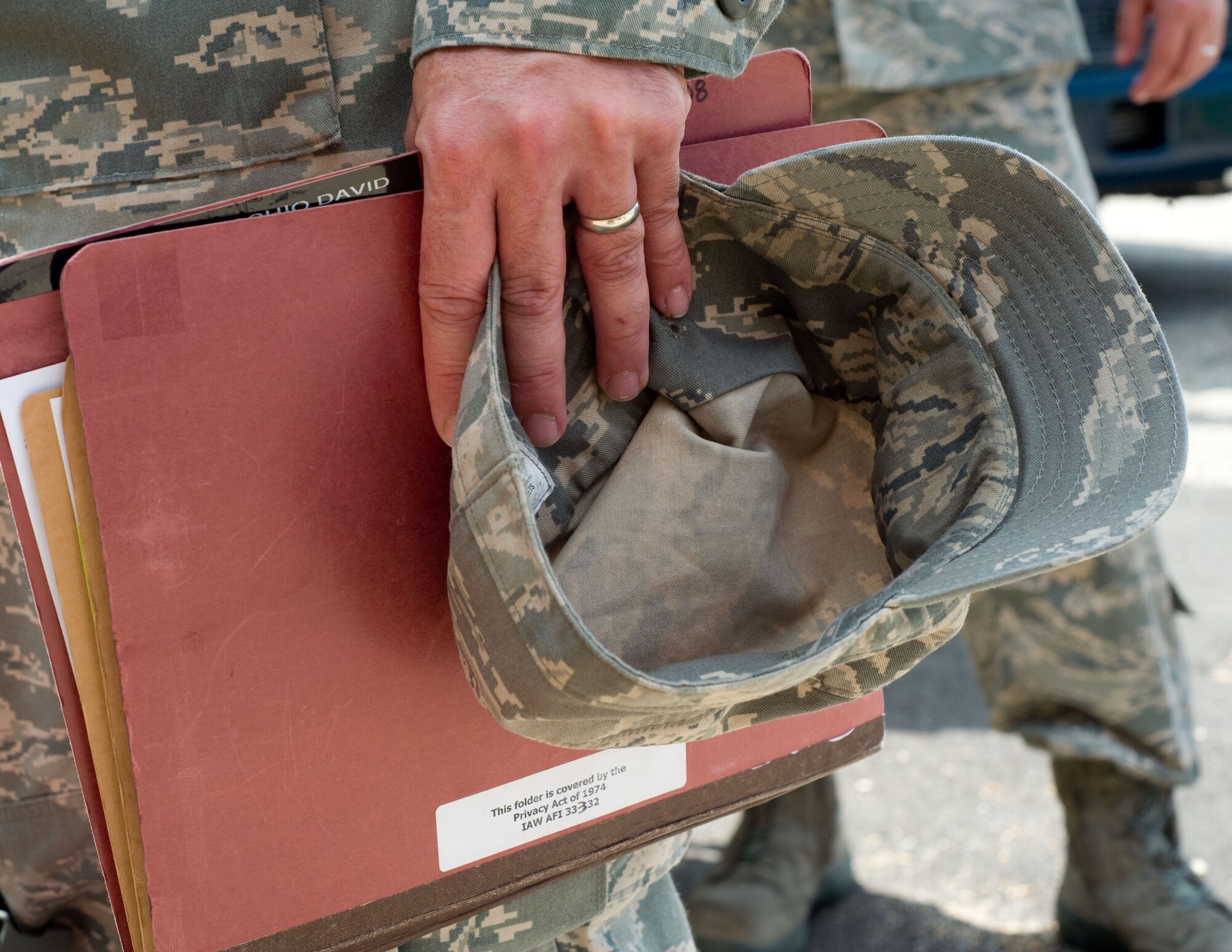 LANGLEY AIR FORCE BASE, Va. – A Langley Airman carries his mobility folder prior to his deployment to Andersen Air Force Base, Guam, June 2. The deployment, which will last approximately four months, is a prudent measure to maintain a credible deterrent posture and presence for the region and demonstrate a continued U.S. commitment to fulfilling security responsibilities throughout the Western Pacific. (U.S. Air Force photo/Staff Sgt. Barry Loo)
