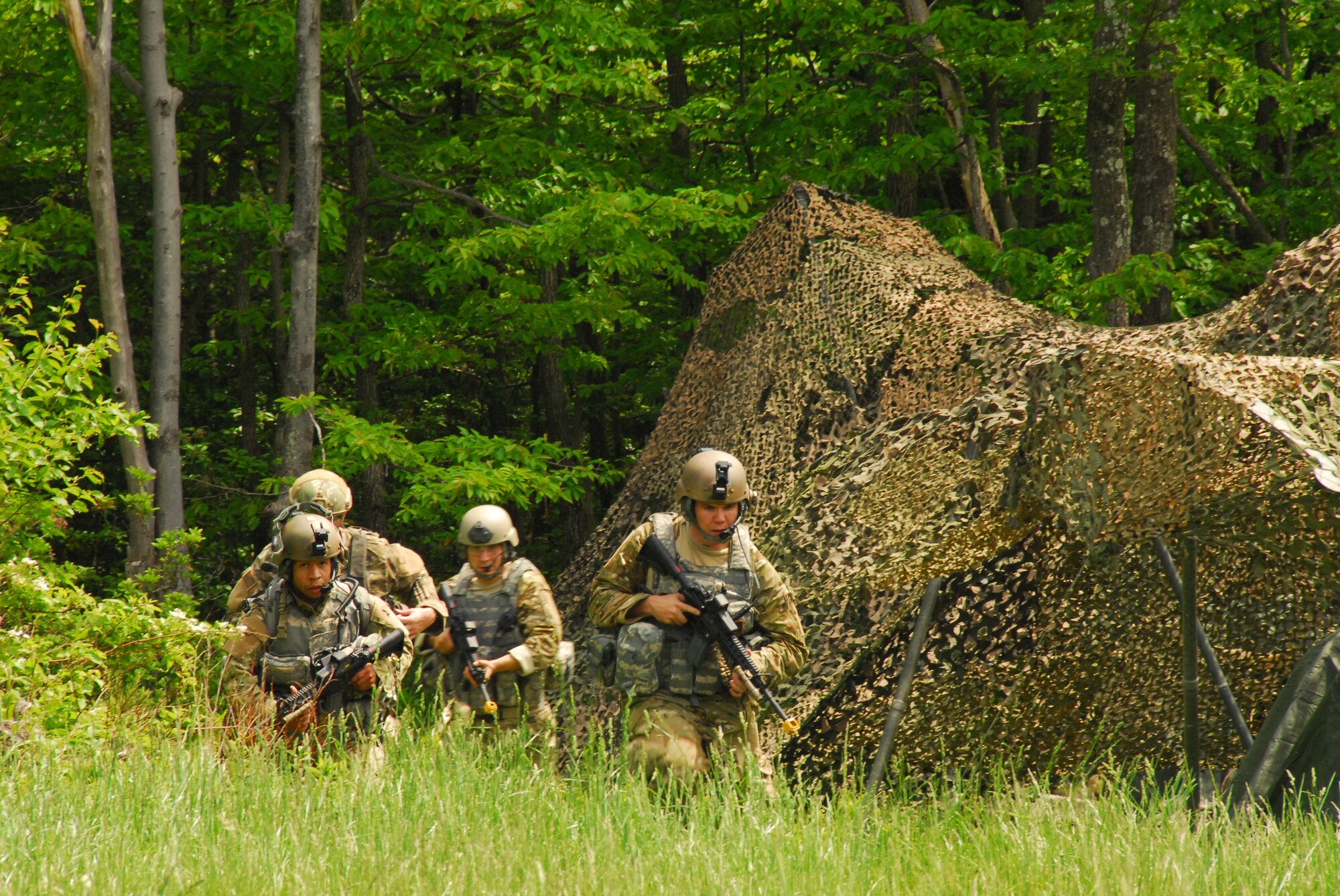 Tactical Air Control Party Airman of the 193rd Special Operations Wing?s 148th Air Support Operations Squadron, Fort Indiantown Gap, Annville, Pa., run from their tents to their bunker after hearing incoming enemy missiles. The threat of incoming enemy fire was one of many scenarios the Airmen faced as part of the four-day field training exercise at Fort Indiantown Gap. 
