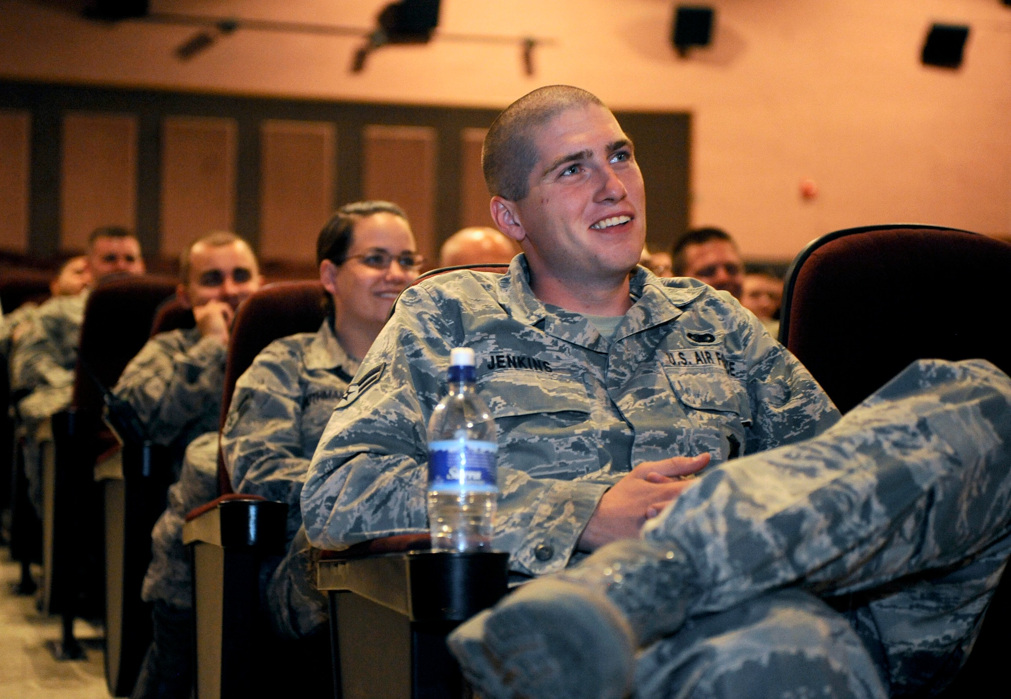 HOLLOMAN AIR FORCE BASE, N.M. -- Airmen laugh during a "Happy Hour" comedy show with comedian, Bernie McGrenahan, during Safety Day, June 1, 2010. The show, coordinated by the Sexual Assault Response and Prevention Office, began with 30 minutes of comedy, followed by an intense training session showcased through his own personal experiences. (U.S. Air Force Base photo by Airman First Class Veronica Stamps / Released)