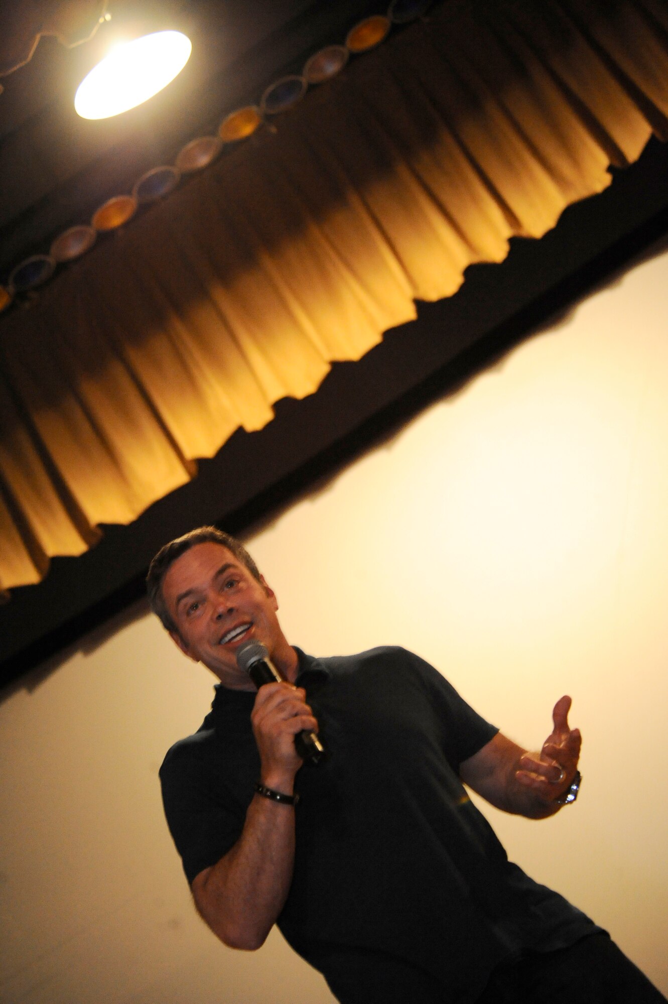 HOLLOMAN AIR FORCE BASE, N.M. -- Bernie McGrenahan, comedian, shares his story on the dangers of alcohol, drugs, sexual conduct and suicide with his "Happy Hour" comedy show at the base theater, June 1, 2010. Traveling from base to base, Bernie uses a comical approach to relate his personal experiences with members of the Armed Forces by showing them the consequences of making bad decisions. (U.S. Air Force Base photo by Airman First Class Veronica Stamps / Released)