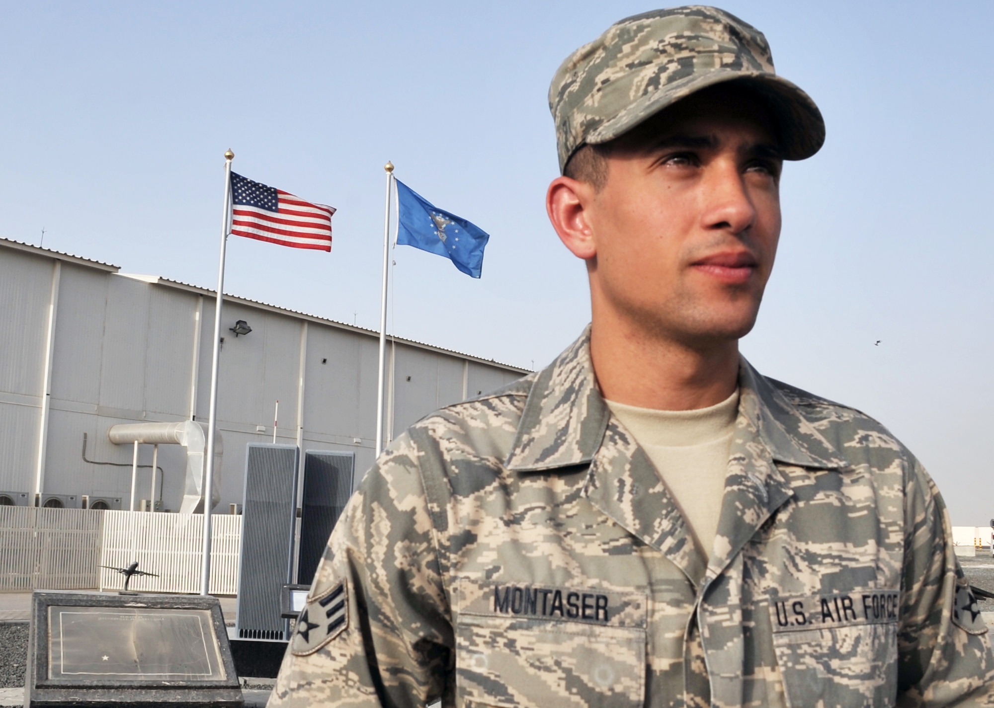 Senior Airman Abdul Montaser is a services journeyman with the 380th Expeditionary Force Support Squadron at a non-disclosed base in Southwest Asia. Here he is pictured next to the 380th Air Expeditionary Wing's 9-11 memorial. He is deployed from the New Jersey Air National Guard?s 108th Force Support Squadron at Joint Base McGuire-Dix-Lakehurst, N.J., and his hometown is Brooklyn, N.Y. (U.S. Air Force Photo/Master Sgt. Scott T. Sturkol/Released) 