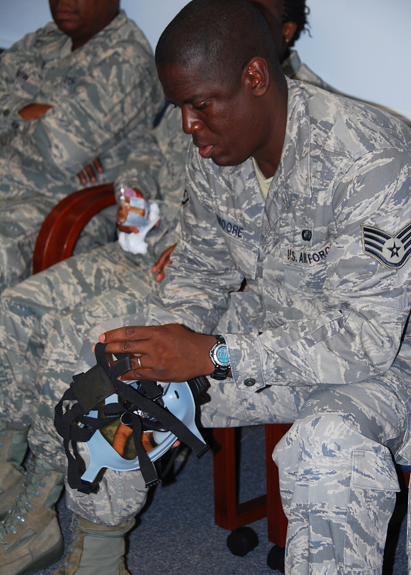 JOINT BASE MCGUIRE-DIX-LAKEHURST, NJ -- Staff Sgt. James Moore, 514th Air Mobility Wing Reserve Financial Management Office, inspects his gas mask as part of annual block training requirements here June 3, 2010. During block training, Reserve Airmen spend four days reviewing and practicing basic skills in addition to completing mandatory ancillary training. (U.S. Air Force photo/Staff Sgt. Shawn J. Jones)