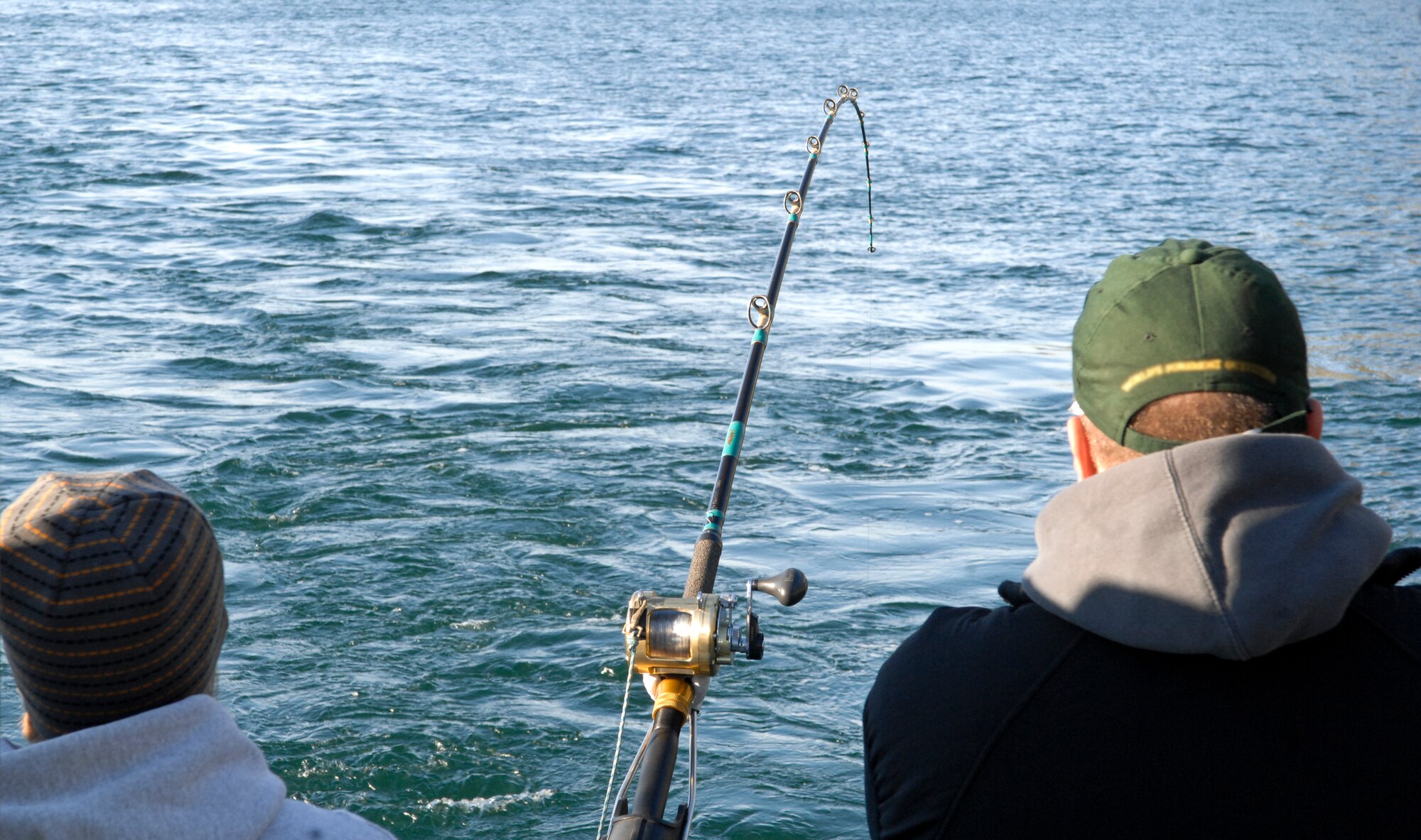 Members of the Fourth Annual Armed Service Veteran Combat Fishing Tournament wait paitently while watching their fishing poles awaiting a bite. The tournament is the largest military appreciation fishing tournament in the nation. (Air Force photo by Airman 1st Class Jack Sanders)