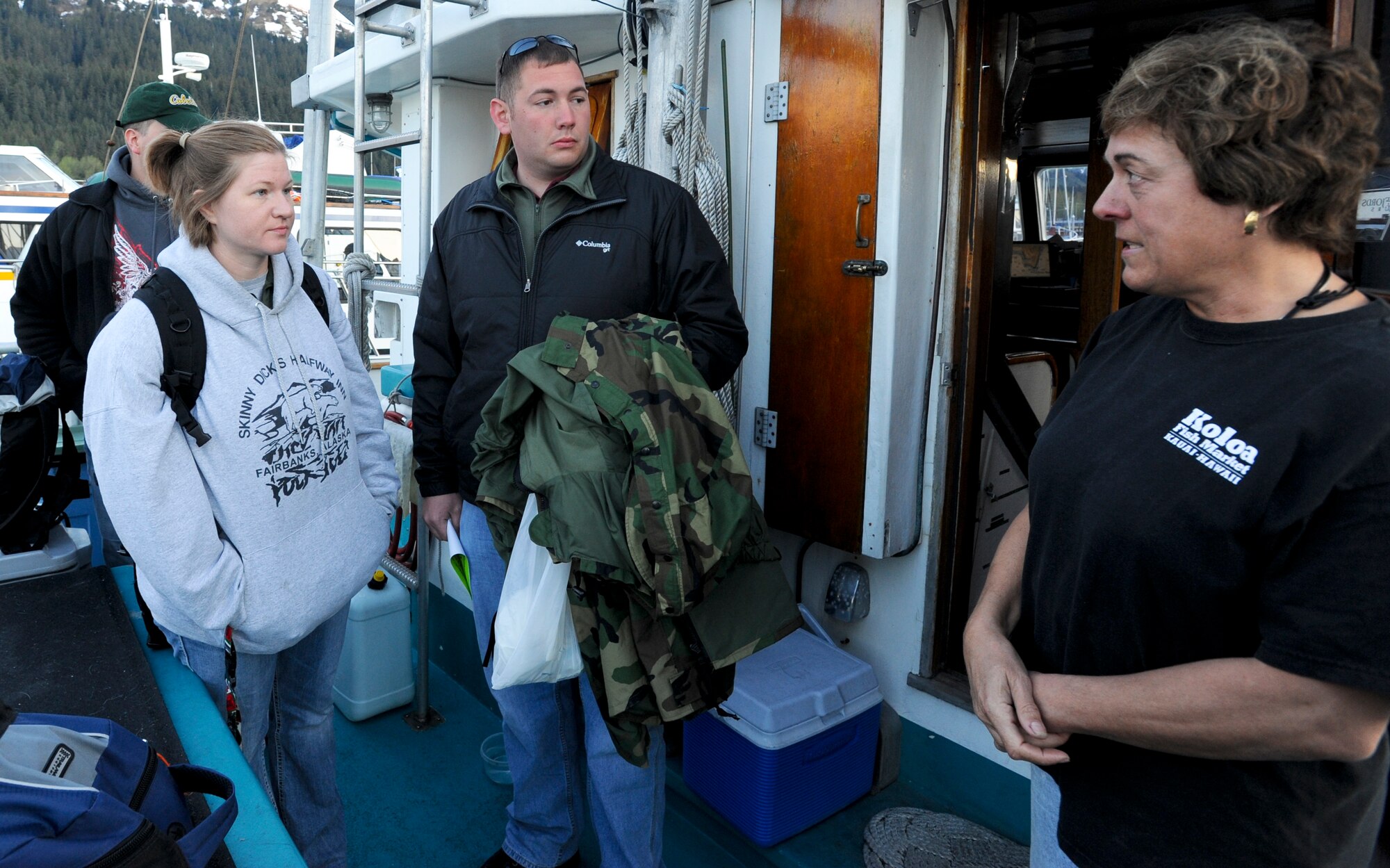 Participants of the Fourth Annual Armed Service Veteran Combat Fishing Tournament listen attentively as their captain gives a quick safety brief before the group leaves the harbor May 27. The tournament is the largest military appreciation fishing tournament in the nation. (Air Force photo by Airman 1st Class Jack Sanders)