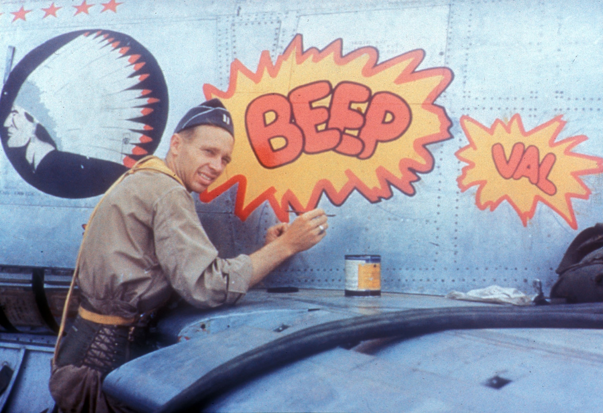 Fighter aircraft often carried decorative “nose art” in Korea. Pictured here is Capt. Karl Dittmer Jr., an F-86 pilot with three MiG kills, at work. Dittmer painted nose art on many of the 335th Fighter Interceptor Squadron’s Sabres at Kimpo. (U.S. Air Force photo)