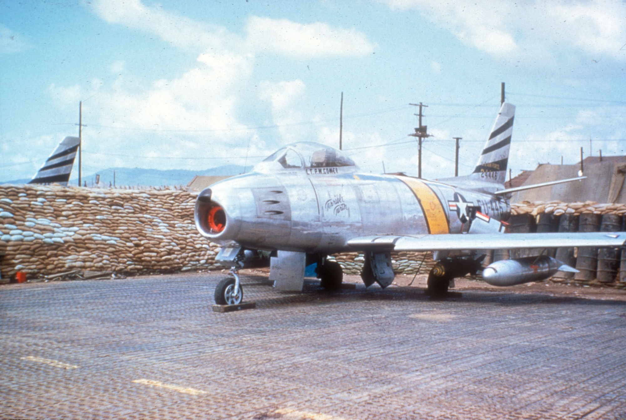 F-86F sitting on PSP (Pierced Steel Planking). PSP was used to create temporary runways. (U.S. Air Force photo)