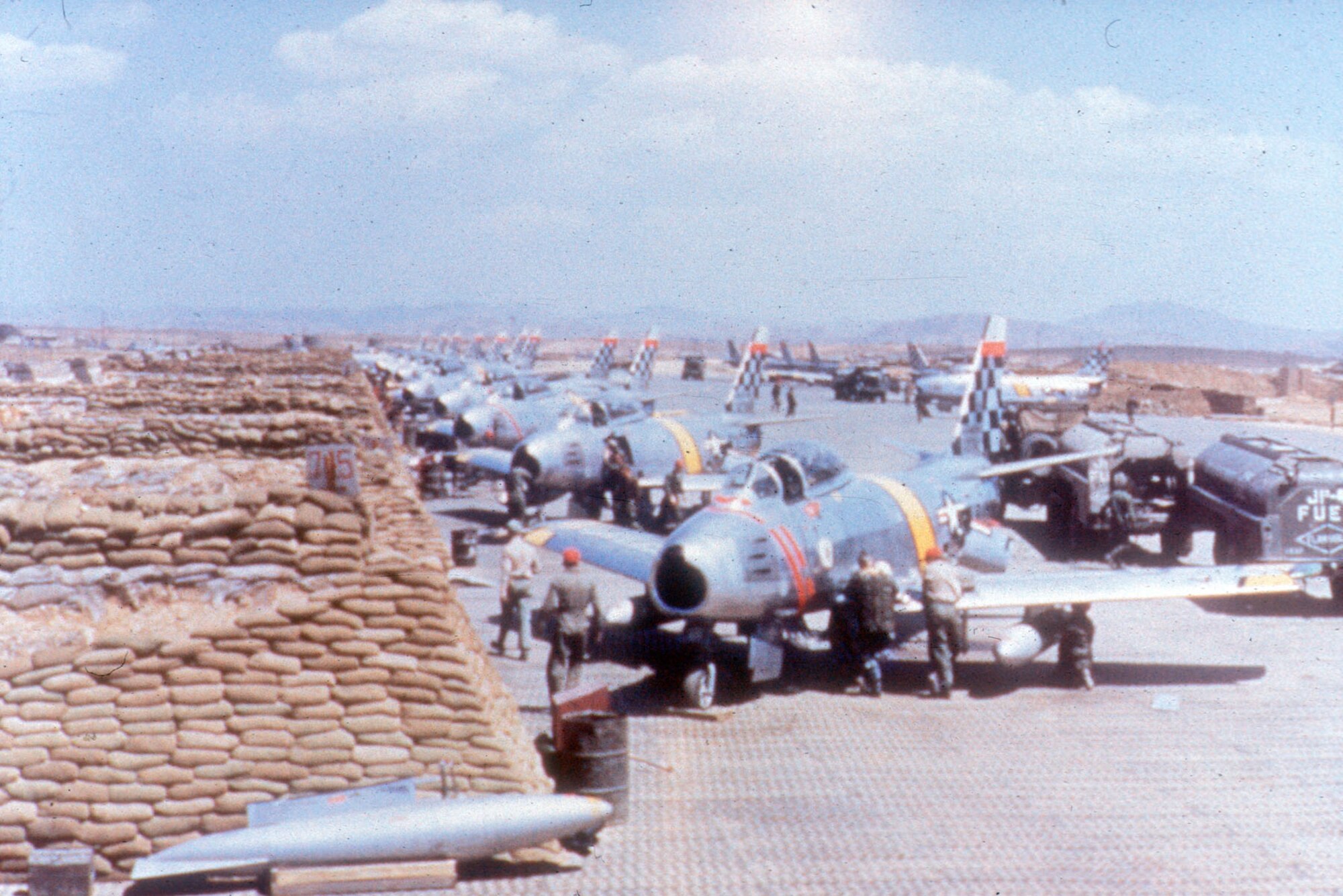 Rows of F-86Es being readied for a mission. (U.S. Air Force photo)