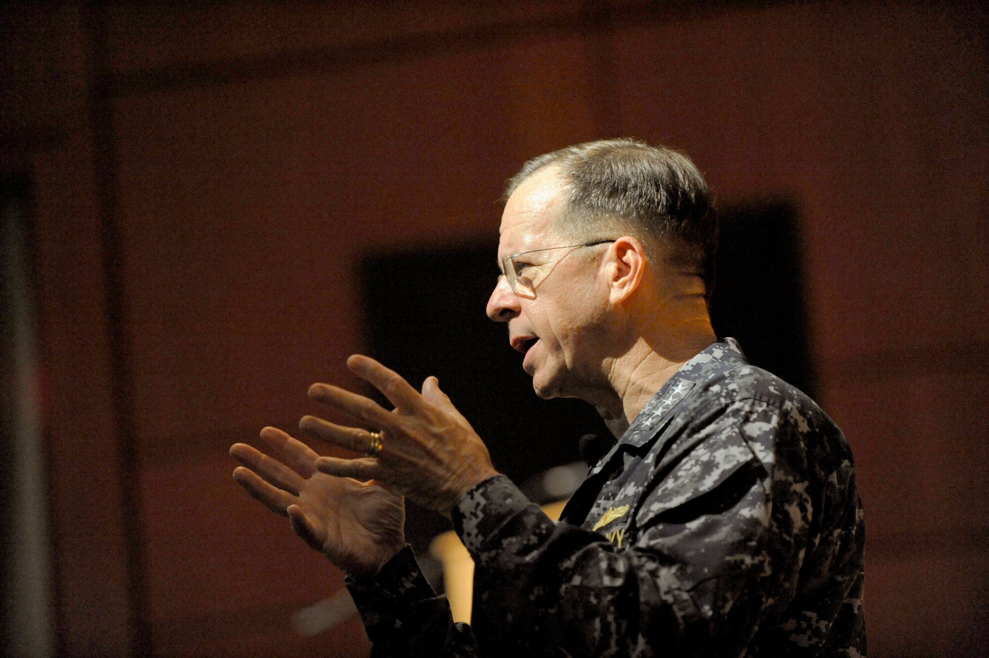 Navy Adm. Michael G. Mullen gives his remarks during an all-hands call at the base theater June 3, 2010, on Joint Base Charleston, S.C. During his visit, Admiral Mullen fielded questions from Airmen and addressed Department of Defense policy changes and expectations. (U.S. Air Force photo/James M. Bowman)