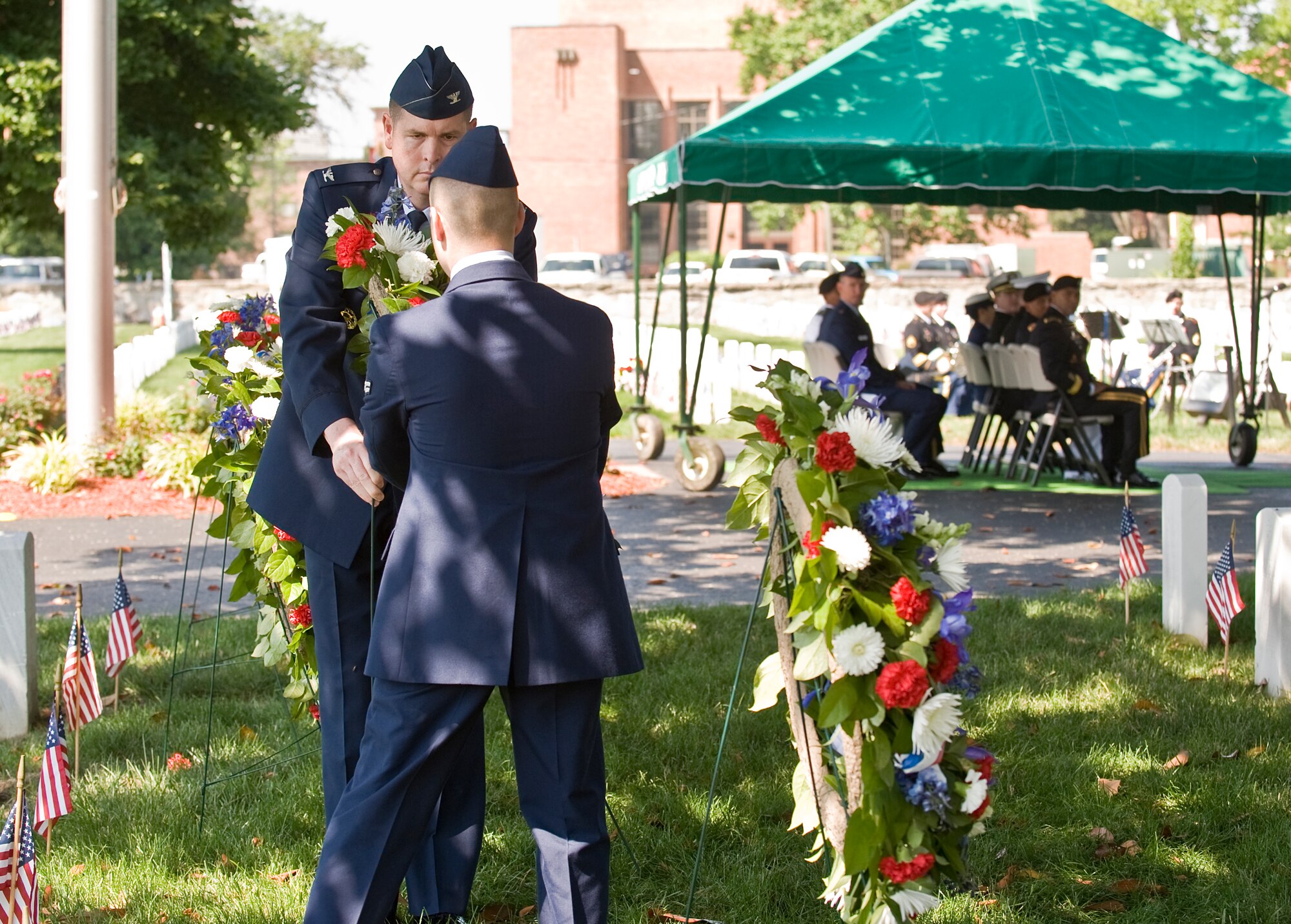 LANGLEY AIR FORCE BASE, Va. -- Col. Donald Kirkland, 633d Air Base Wing commander, and Airman 1st Class Casey Havaich, 1st Aircraft Maintenance Squadron, place a wreath at a headstone during the Memorial Day Ceremony at Hampton National Cemetery May 31.  The ceremony was held to honor servicemembers lost in the line of duty.  (U.S. Air Force photo/Senior Airman Zachary Wolf)
