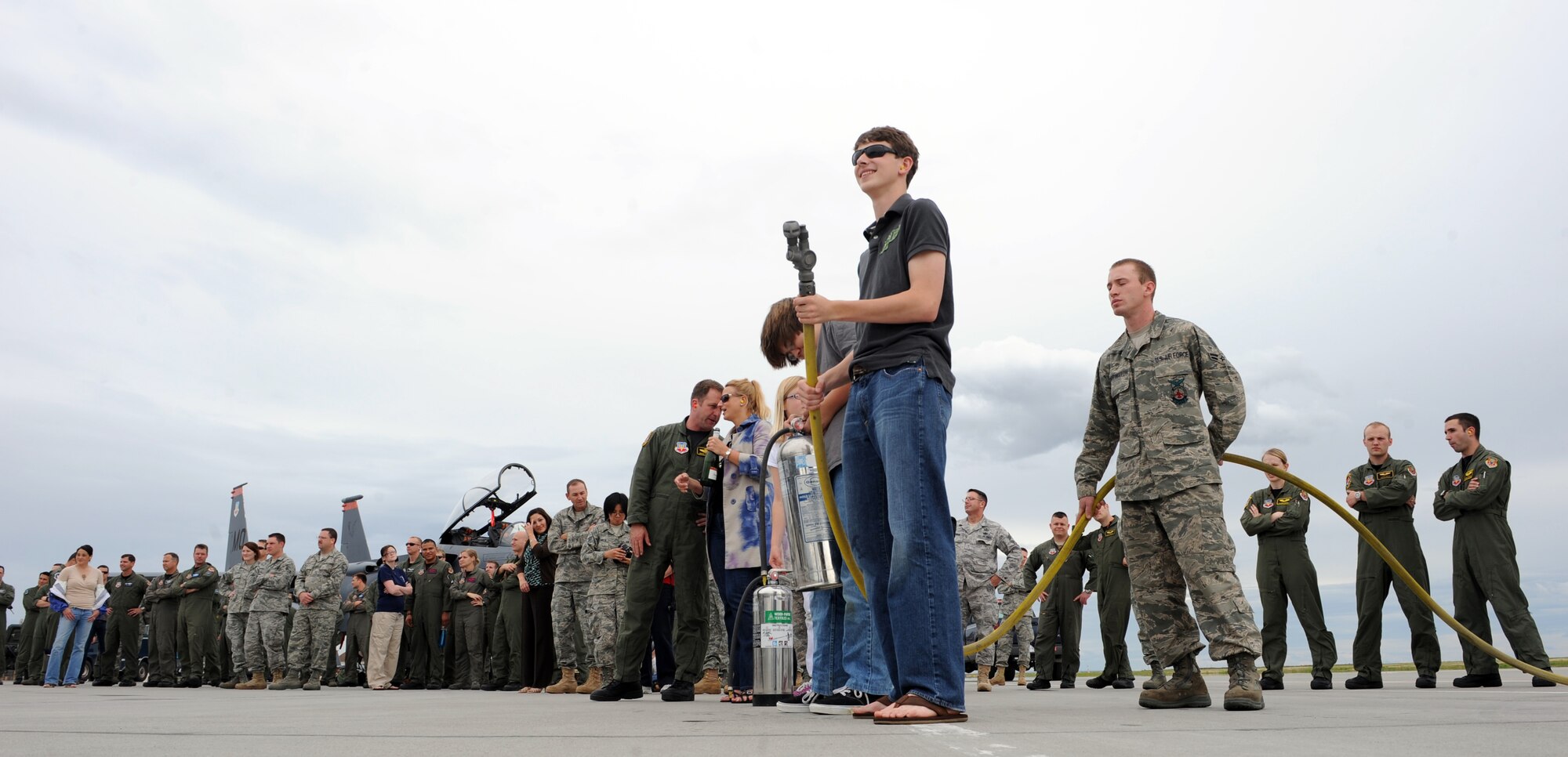 MOUNTAIN HOME AIR FORCE BASE, Idaho – James “Moose” McGovern holds a fire hose as he waits for his father, Col. James McGovern, 366th Operations Group commander, to end his final flight in an F-15E Strike Eagle June 2. Colonel McGovern has been selected as the 607th Air and Space Operations Center commander at Osan Air Base, Korea. (U.S. Air Force photo by Airman 1st Class Debbie Lockhart)