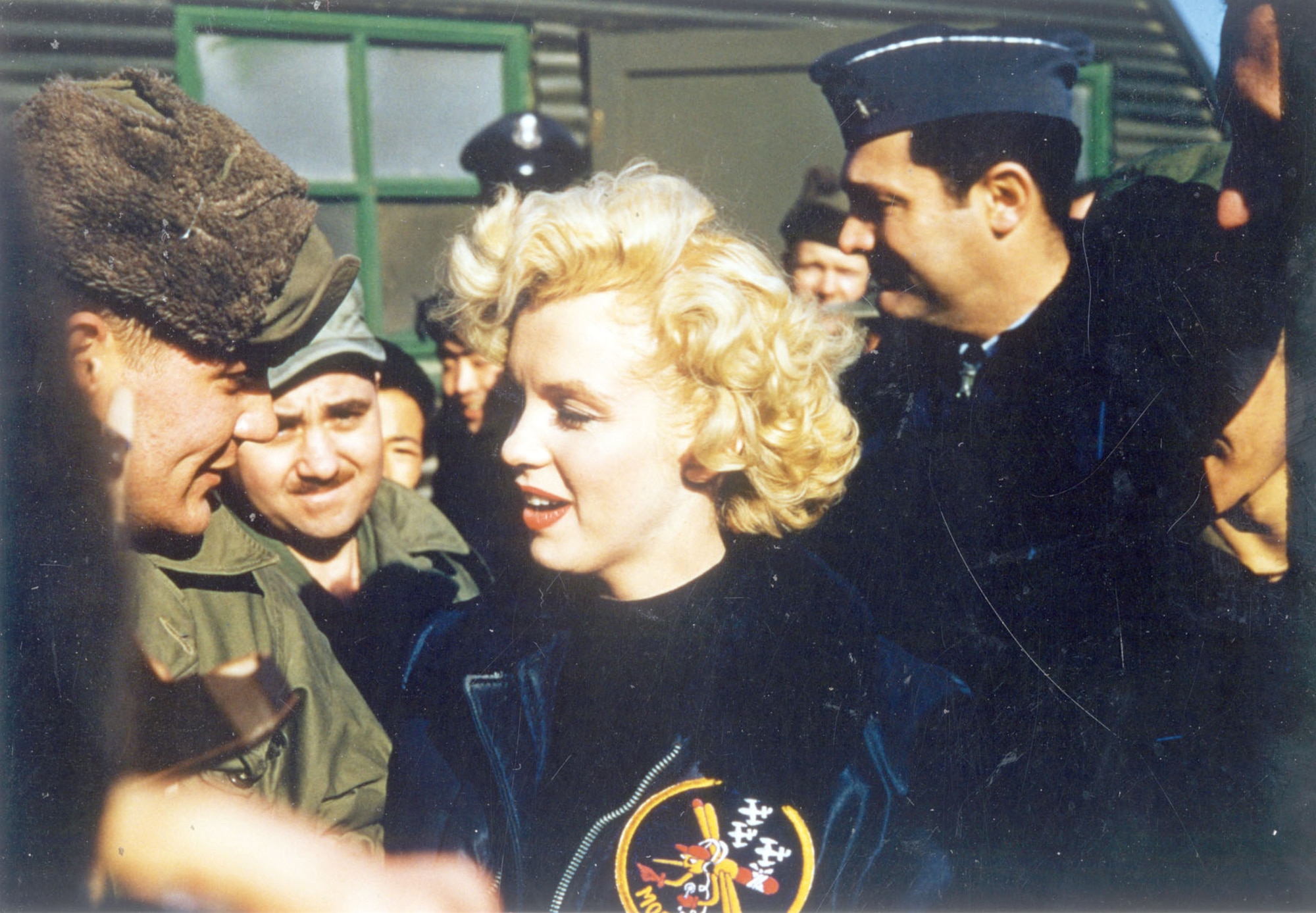 USO personnel and celebrities visited service members in Korea. Baseball player Joe DiMaggio and actress Marilyn Monroe famously toured Korea shortly after the Armistice. Here, Monroe is among Air Force personnel and wearing a 6147th Tactical Control Group jacket. (U.S. Air Force photo)